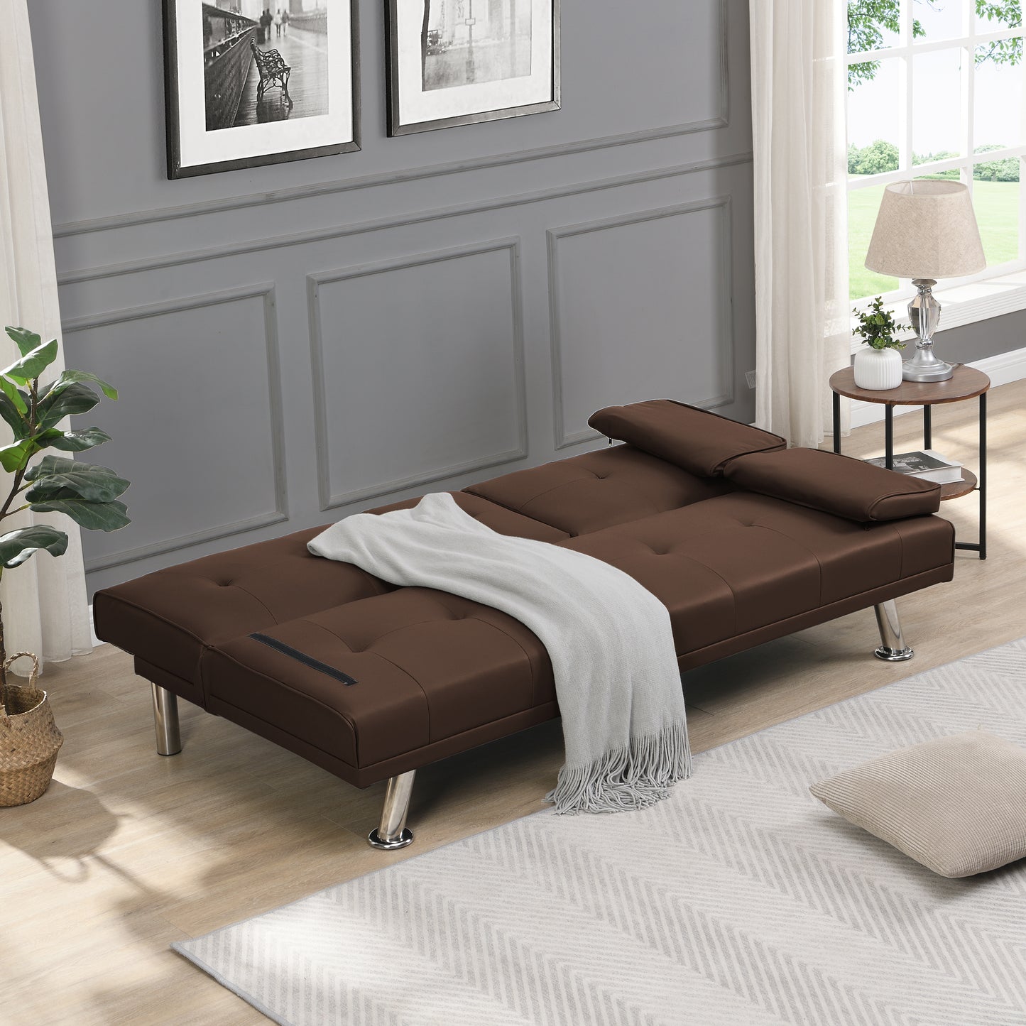 Brown upholstered sofa bed with tufted cushions and chrome legs perfect for small spaces