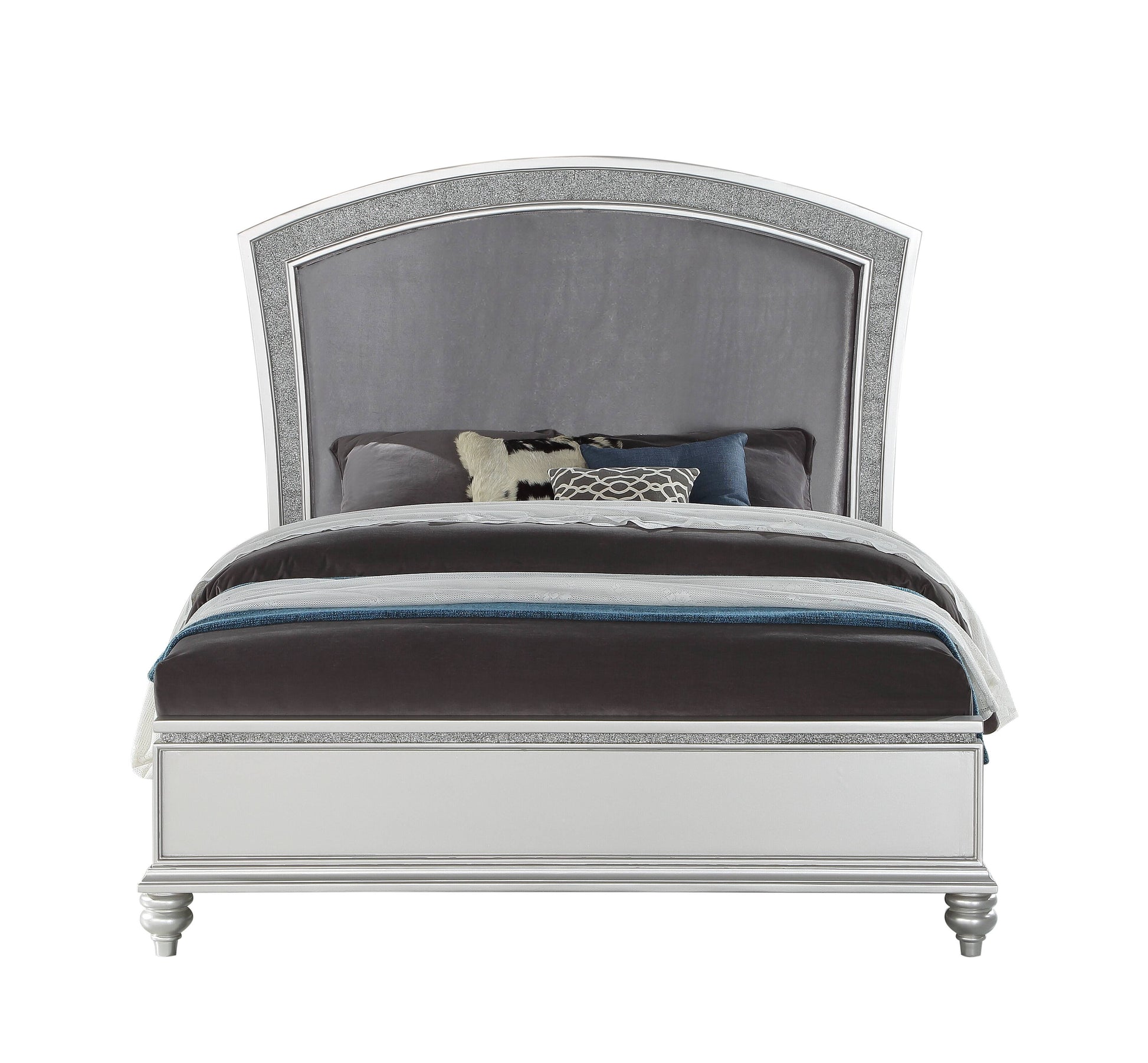 Silver upholstered queen bed with crystalinlaid arched headboard and dark bedding