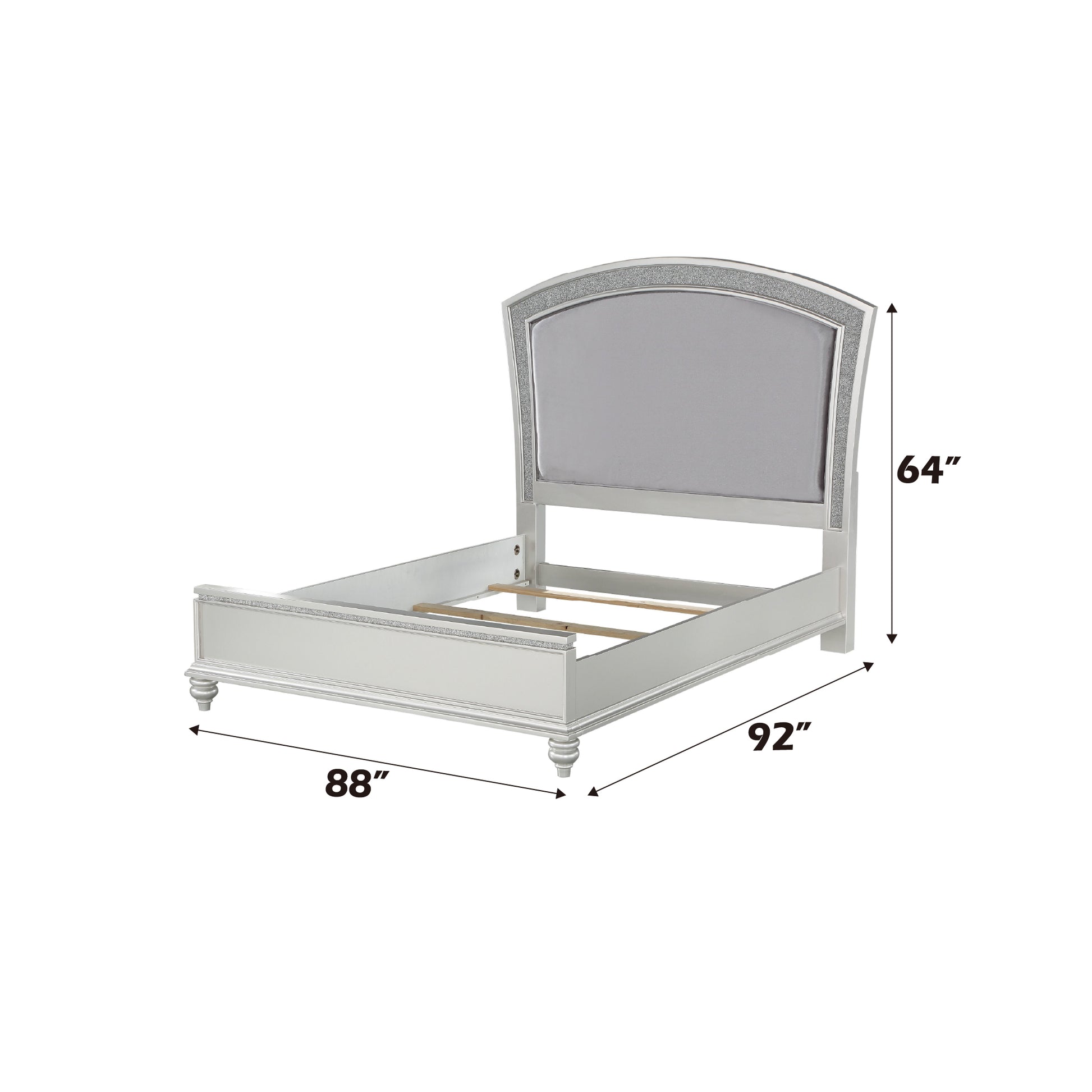 Silver upholstered bed frame with crystal accents and a curved headboard
