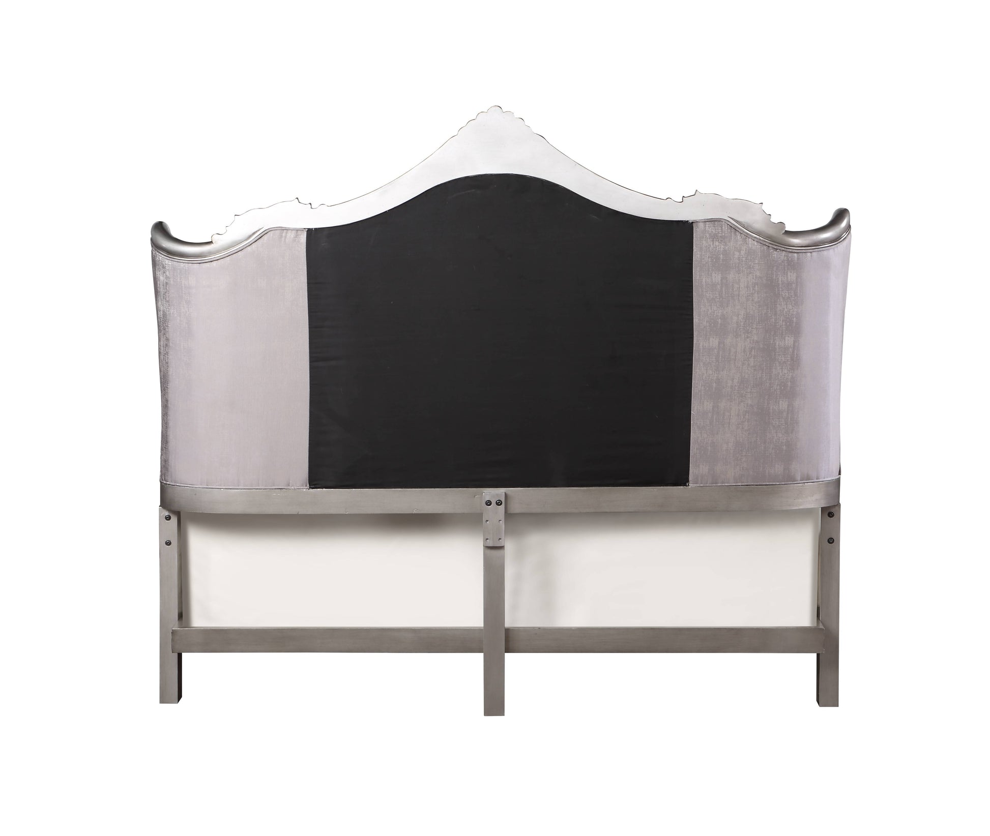 Grey velvet upholstered headboard with silver trim and a dark center panel