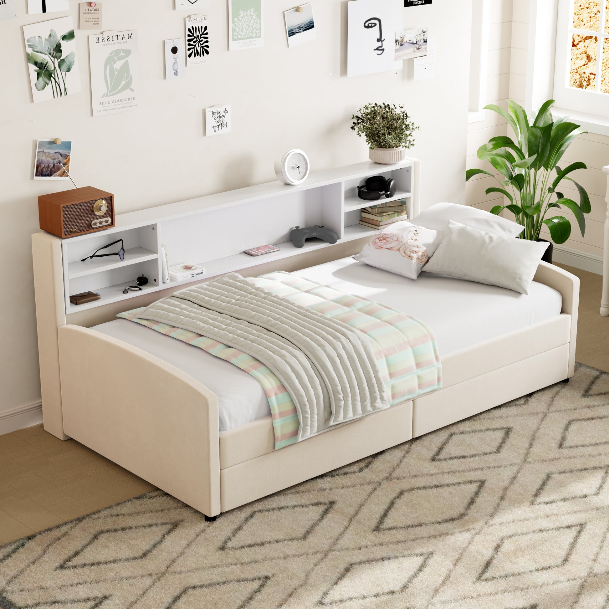 Beige upholstered twin daybed with integrated bookshelf headboard and striped quilt