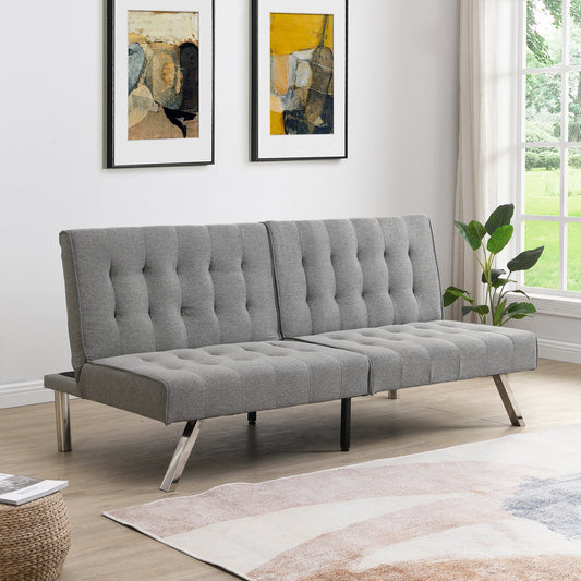 Gray tufted futon sofa with metal legs in a modern living room setting