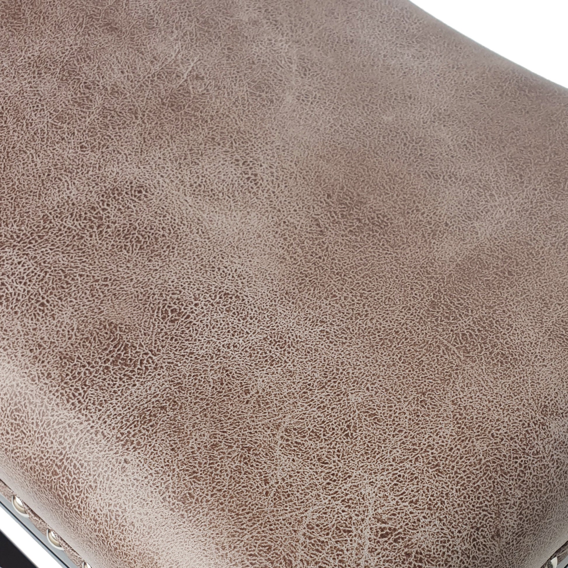 Closeup of textured taupe faux leather upholstery ideal for furniture