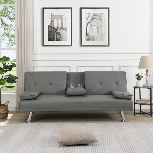 Gray tufted faux leather sofa bed with integrated cup holders for living room relaxation