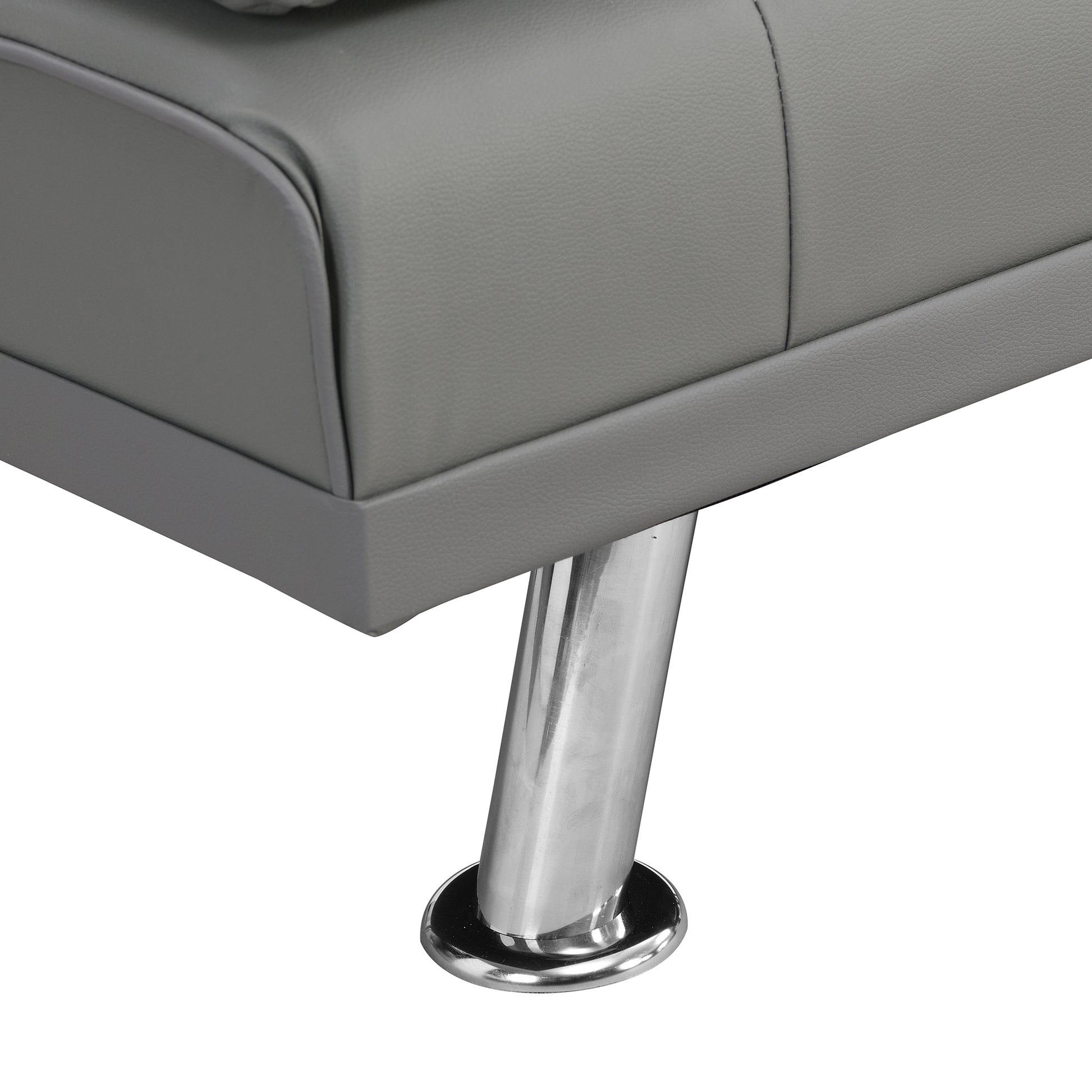 Close up of a grey faux leather sofa armrest with a chrome leg