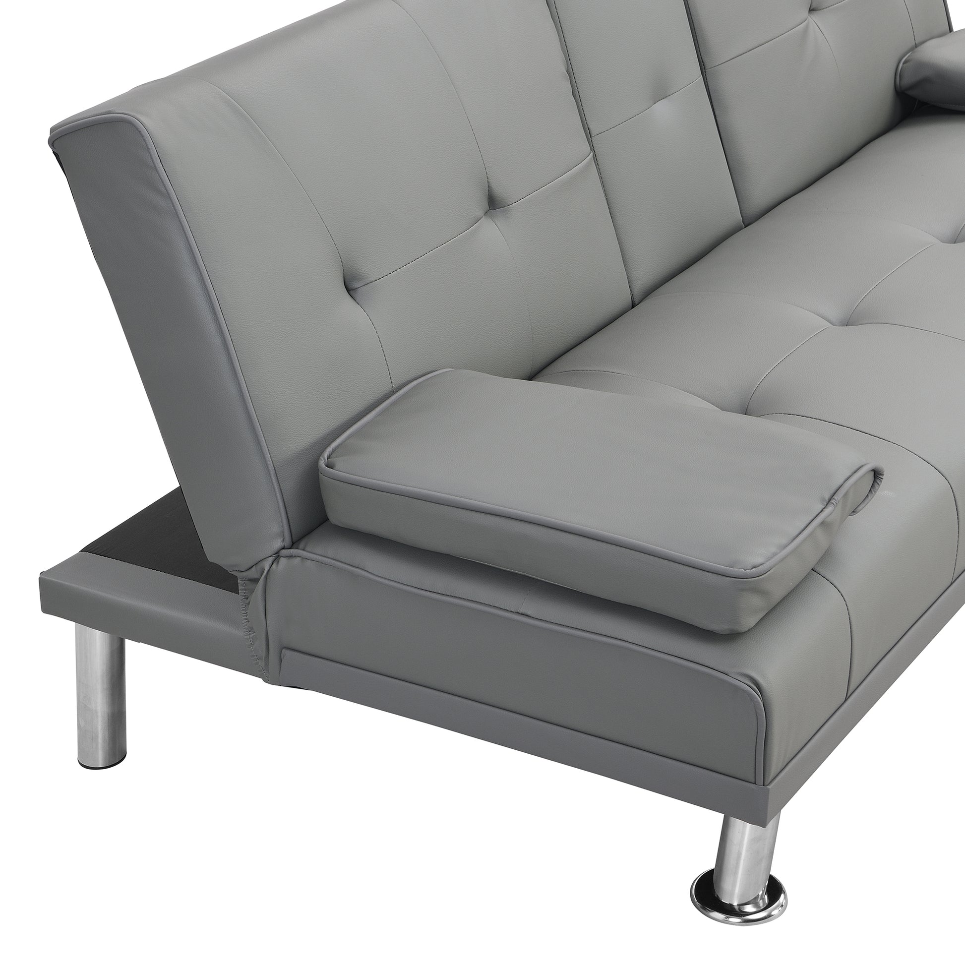 Gray faux leather sofa bed with tufted cushions and silver legs