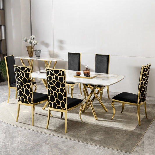Luxurious white marble dining table with golden crossleg base and six black velvet chairs