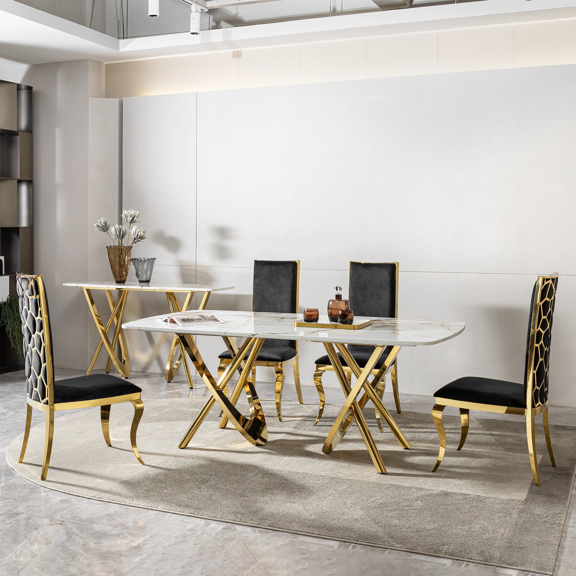 Modern marble dining table with plush black chairs and gold accents