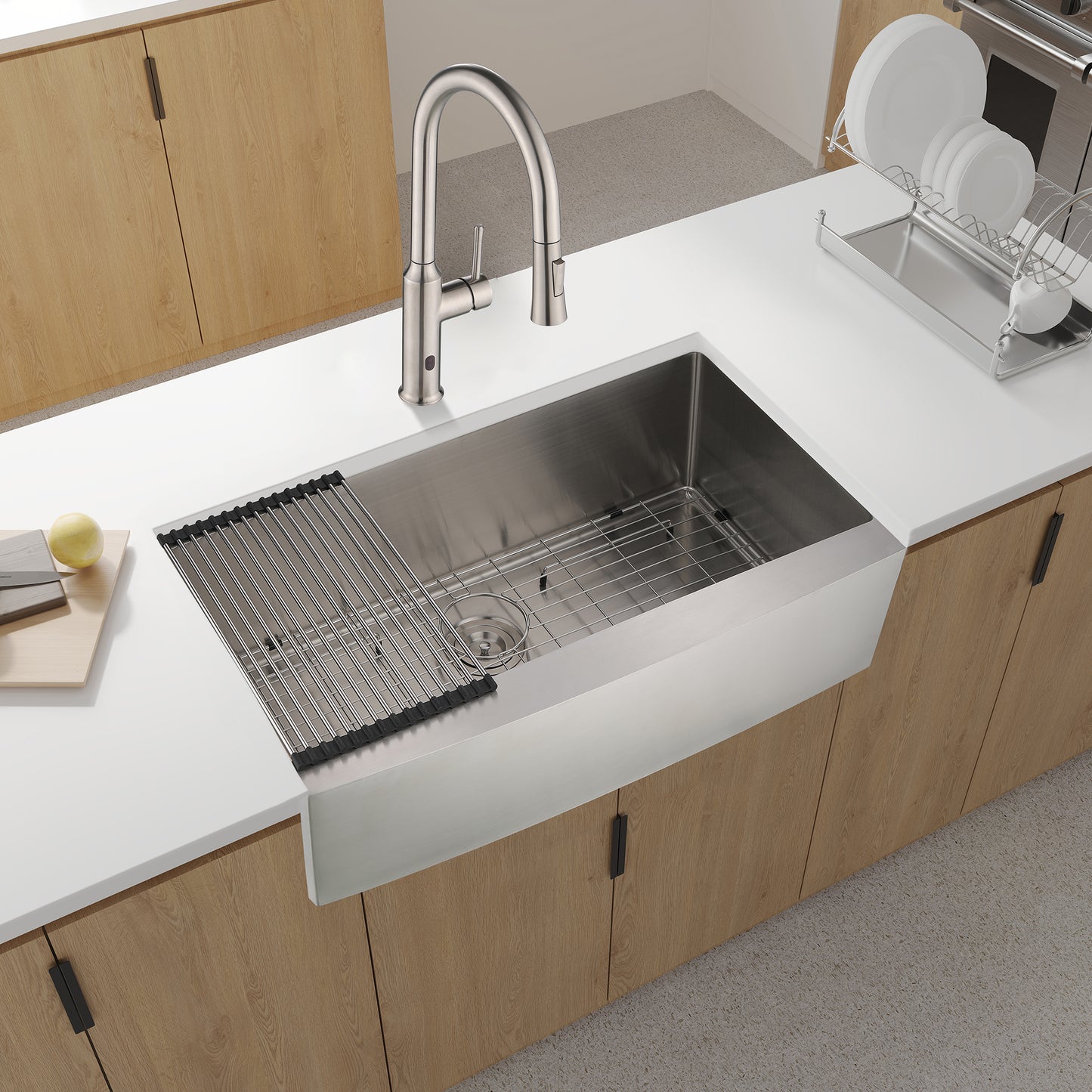 Stainless steel farmhouse sink with brushed nickel faucet and integrated rollup drying rack