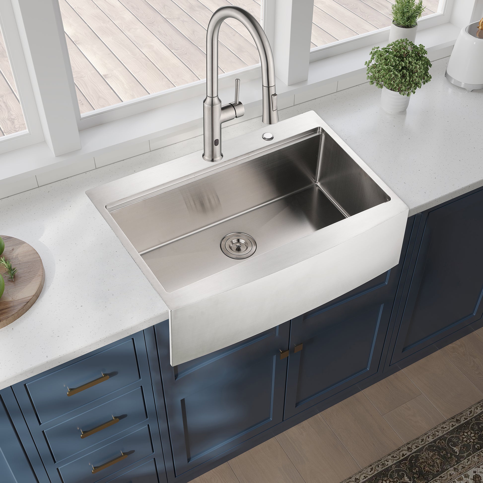 Brushed stainless steel apron front kitchen sink with matte black faucet