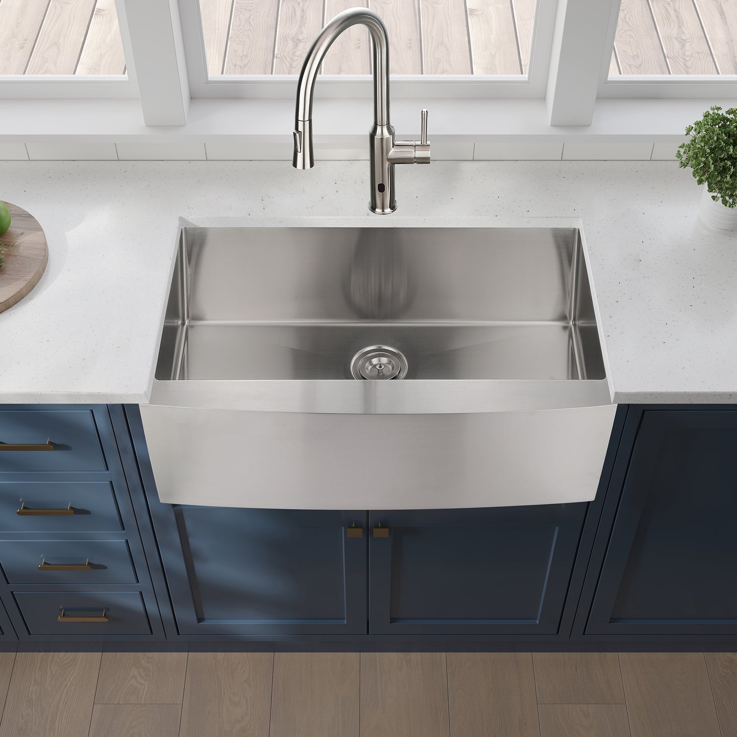Brushed stainless steel farmhouse sink with pulldown faucet and granite countertop