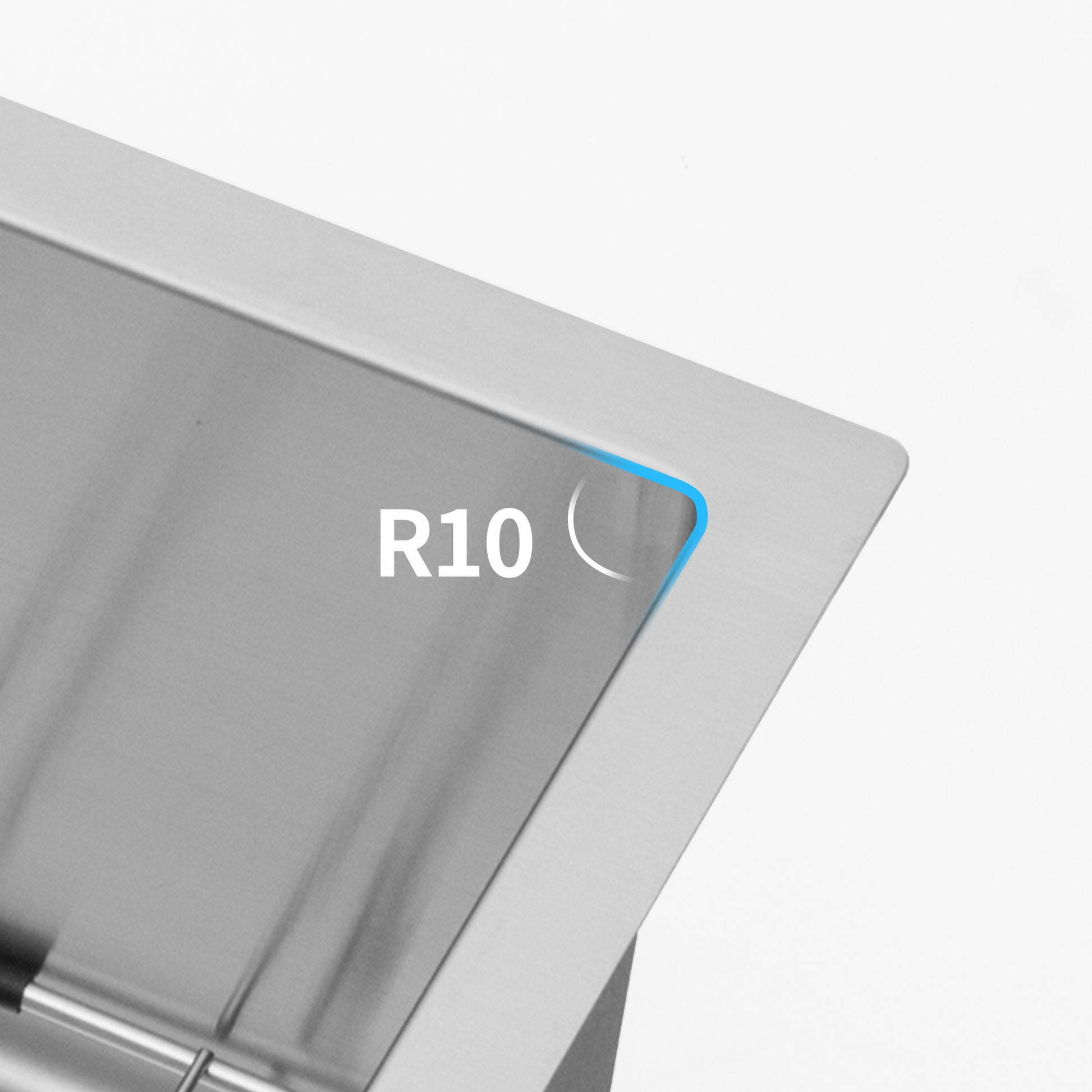 Closeup of brushed stainless steel sink edge with R radius detail