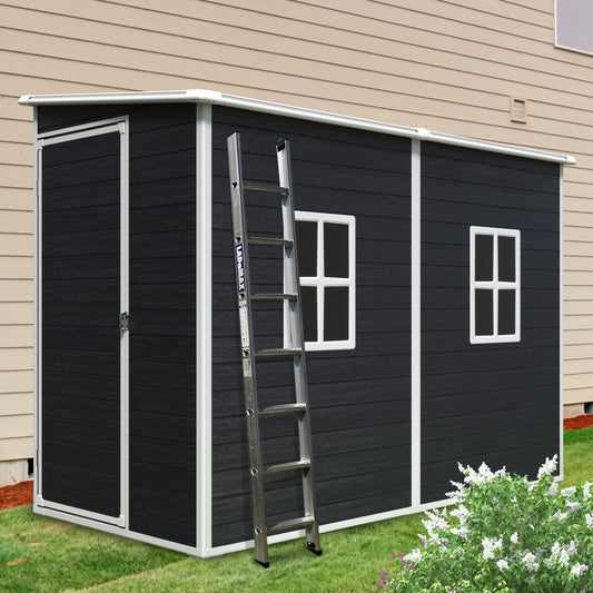 Dark gray resin shed with white trim and two windows perfect for garden storage
