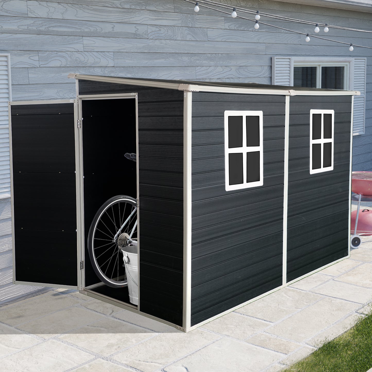 Modern black garden storage shed with a bicycle inside and two windows