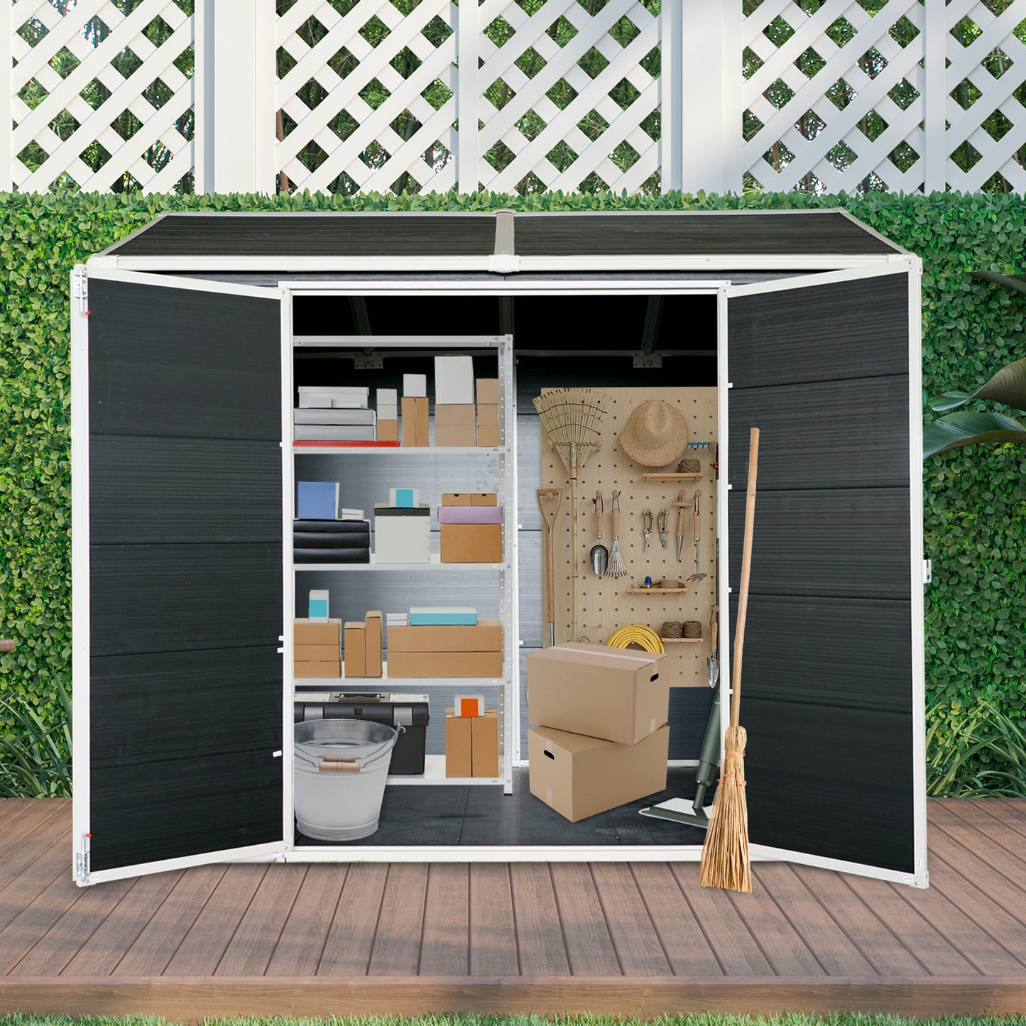 Open black outdoor storage shed with shelves full of boxes and gardening tools