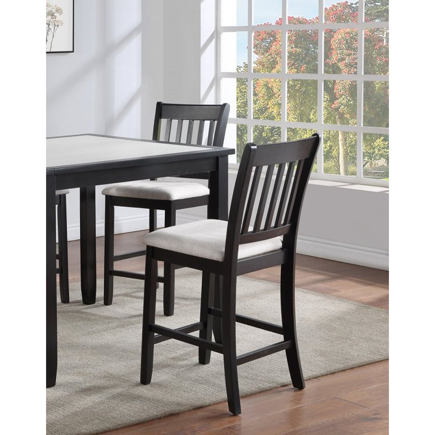 Dark brown wooden counter stool with slatted back and light gray upholstered seat