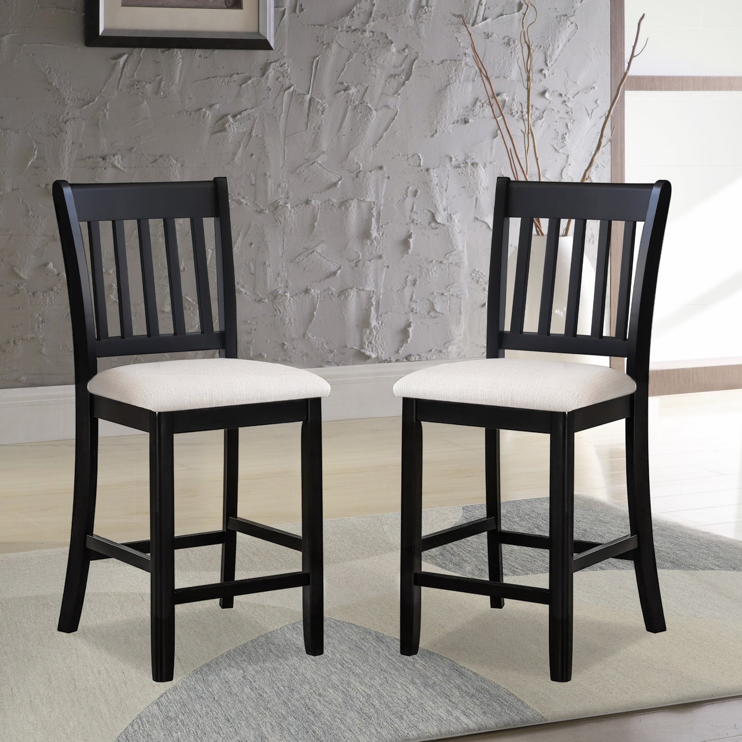 Two black wooden bar stools with white fabric seats perfect for kitchen islands
