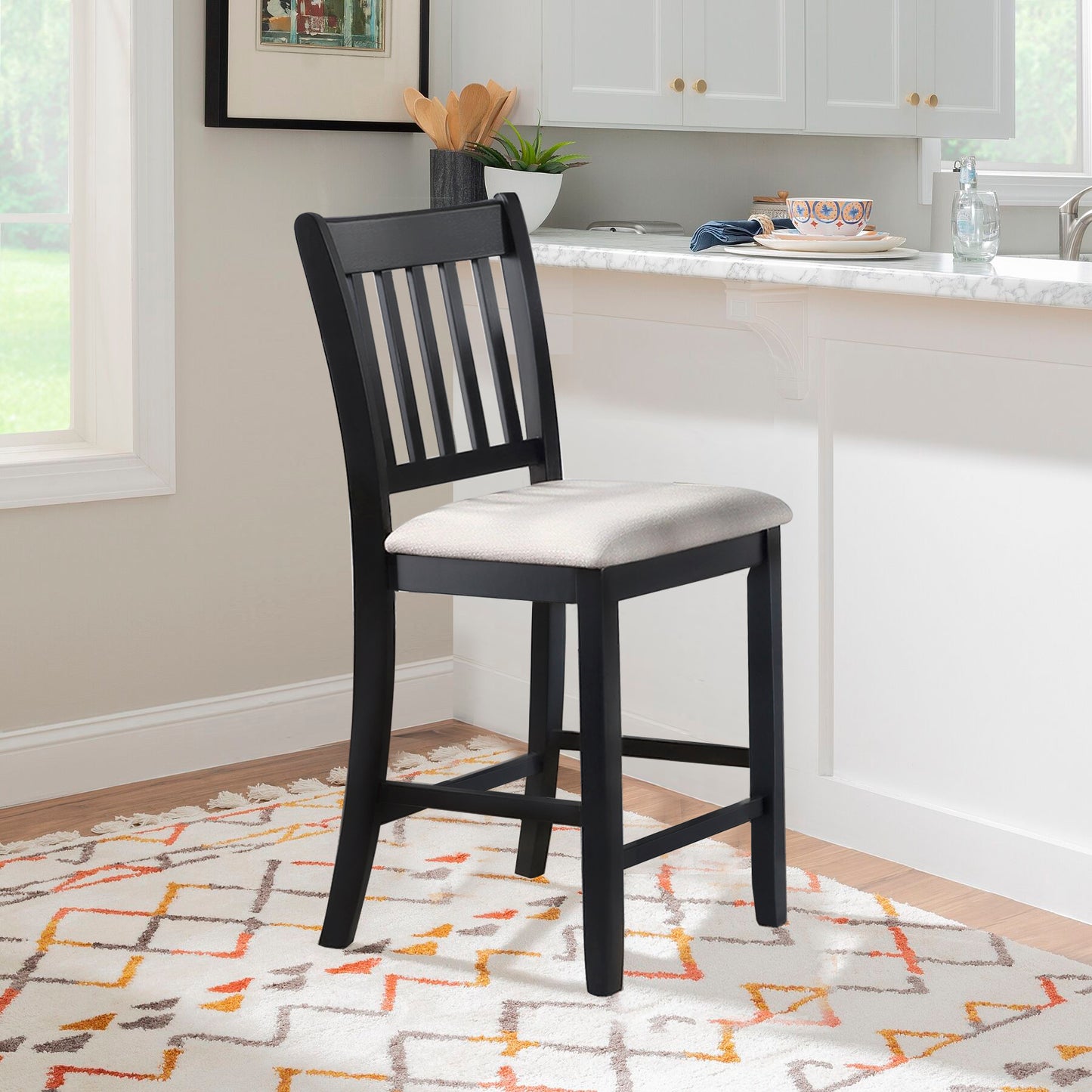 Black wooden bar stool with a light beige upholstered seat and slatted back