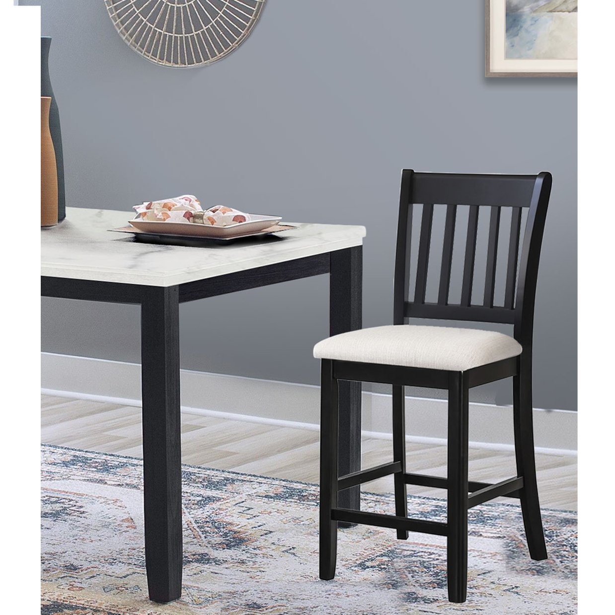 Black wooden counter stool with cushioned beige seat and slatted back