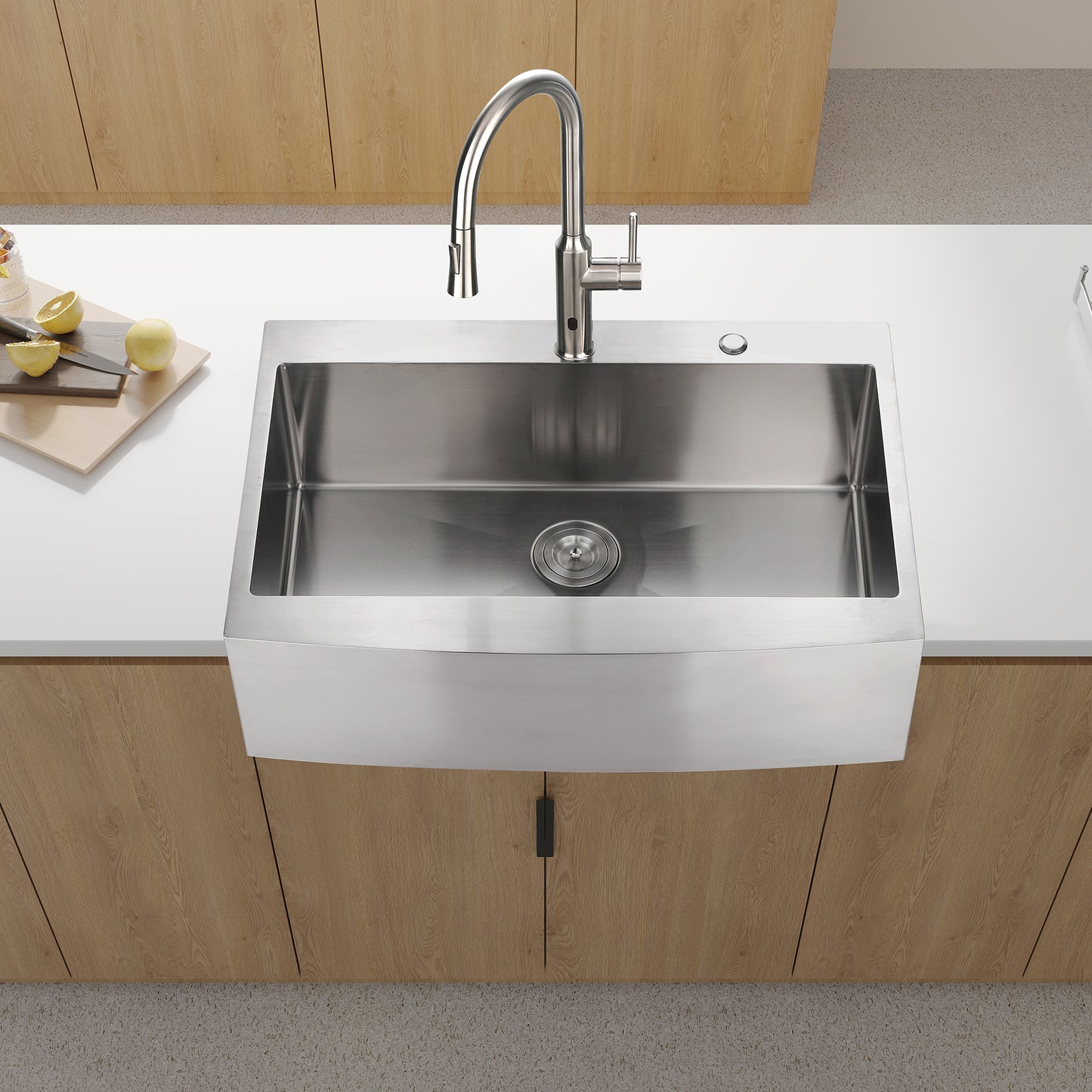 Stainless steel farmhouse sink with modern pulldown faucet and granite countertop