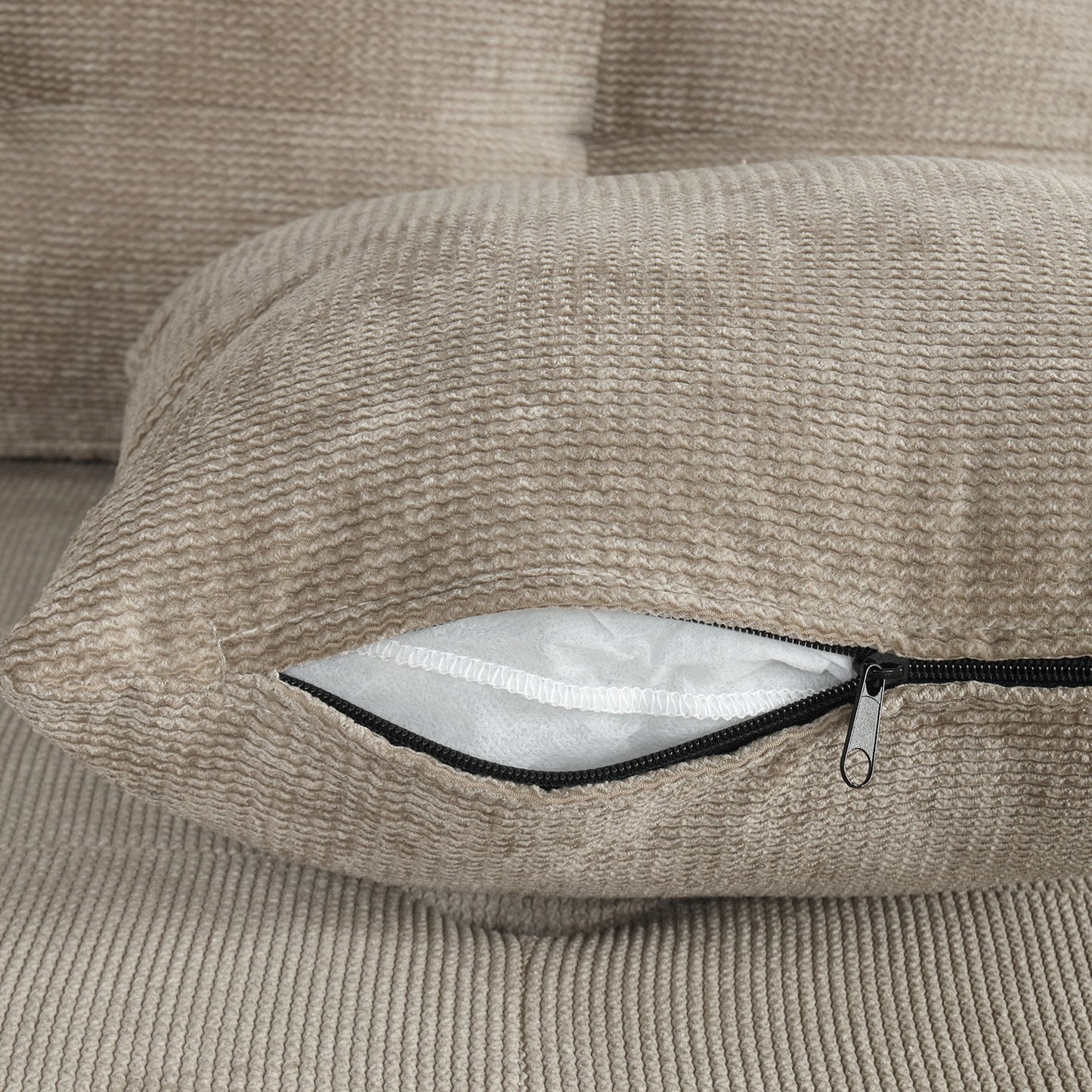 Textured beige cushion cover with visible zipper detail for easy removal