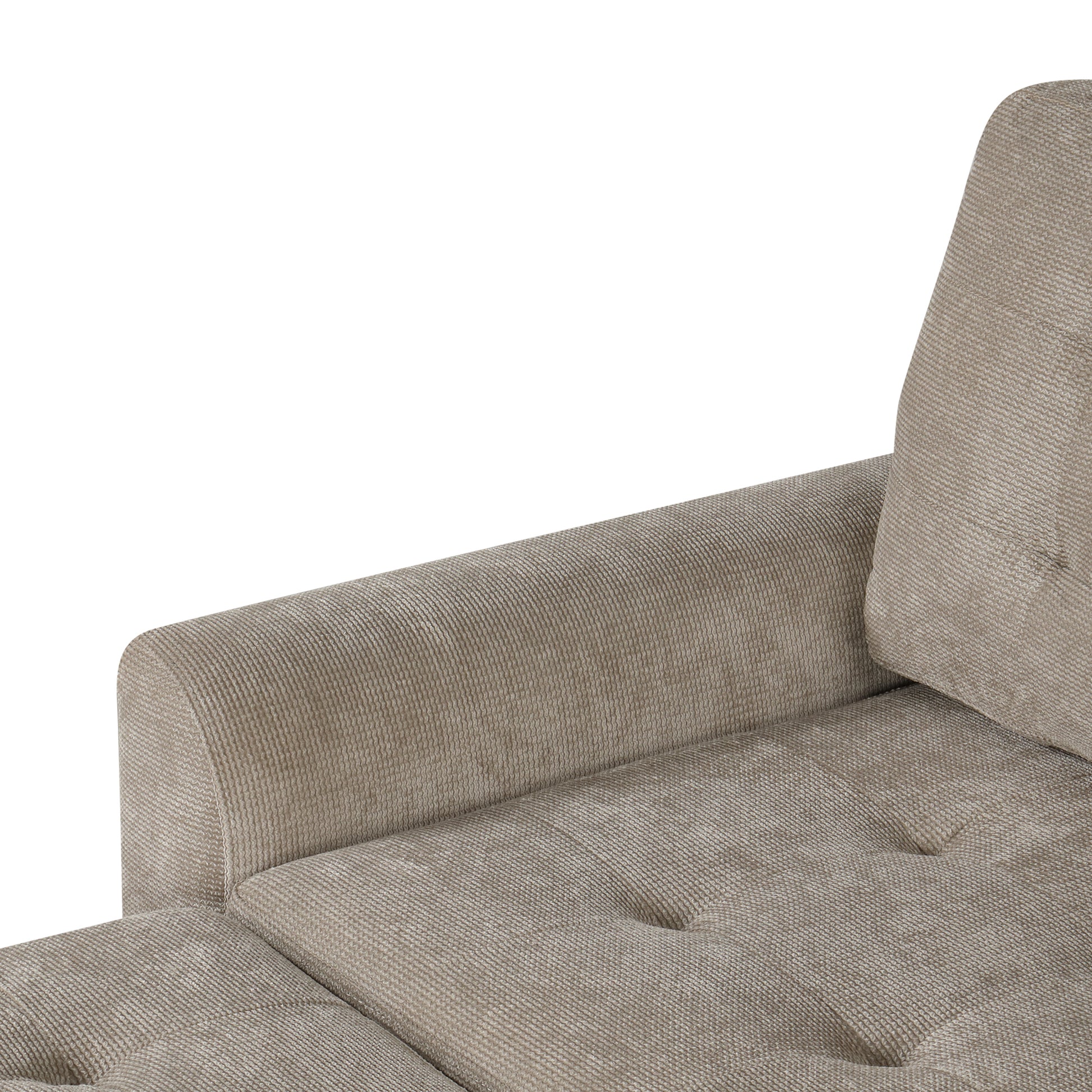 Closeup of beige textured fabric sofa armrest with tufted seat cushion