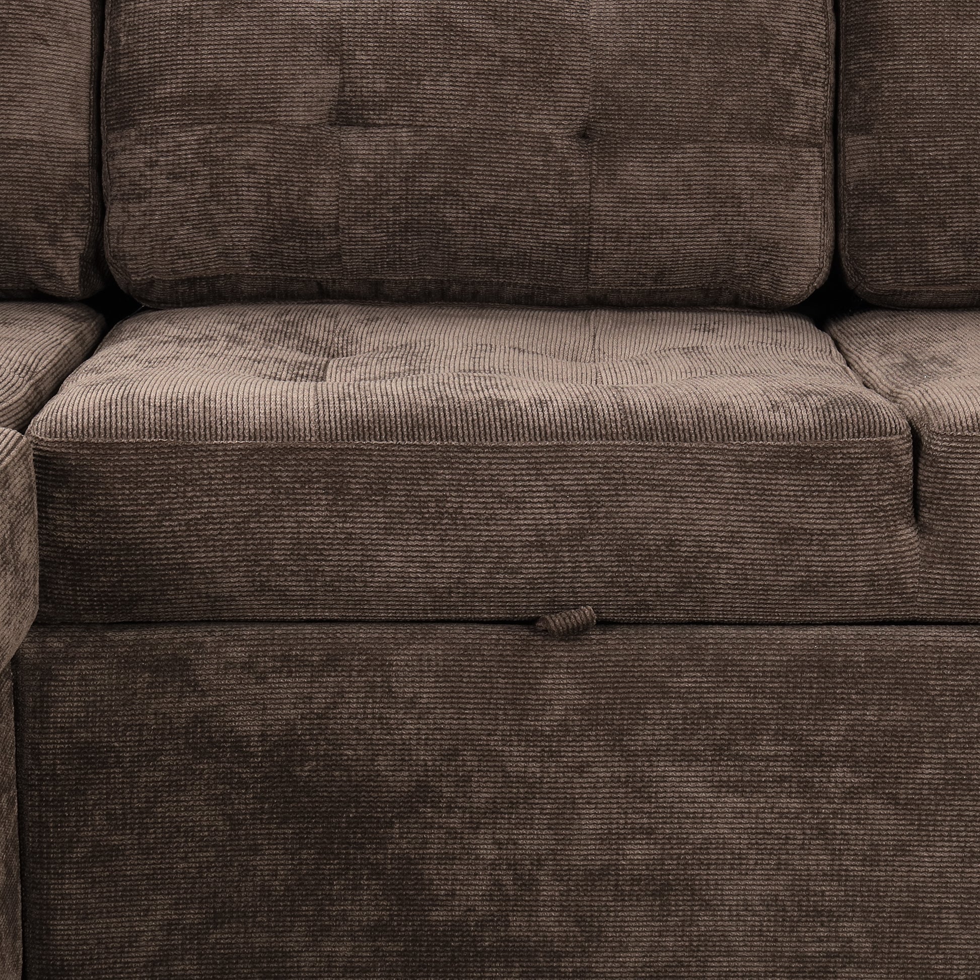 Brown corduroy sectional sofa with tufted seat cushions and hidden storage