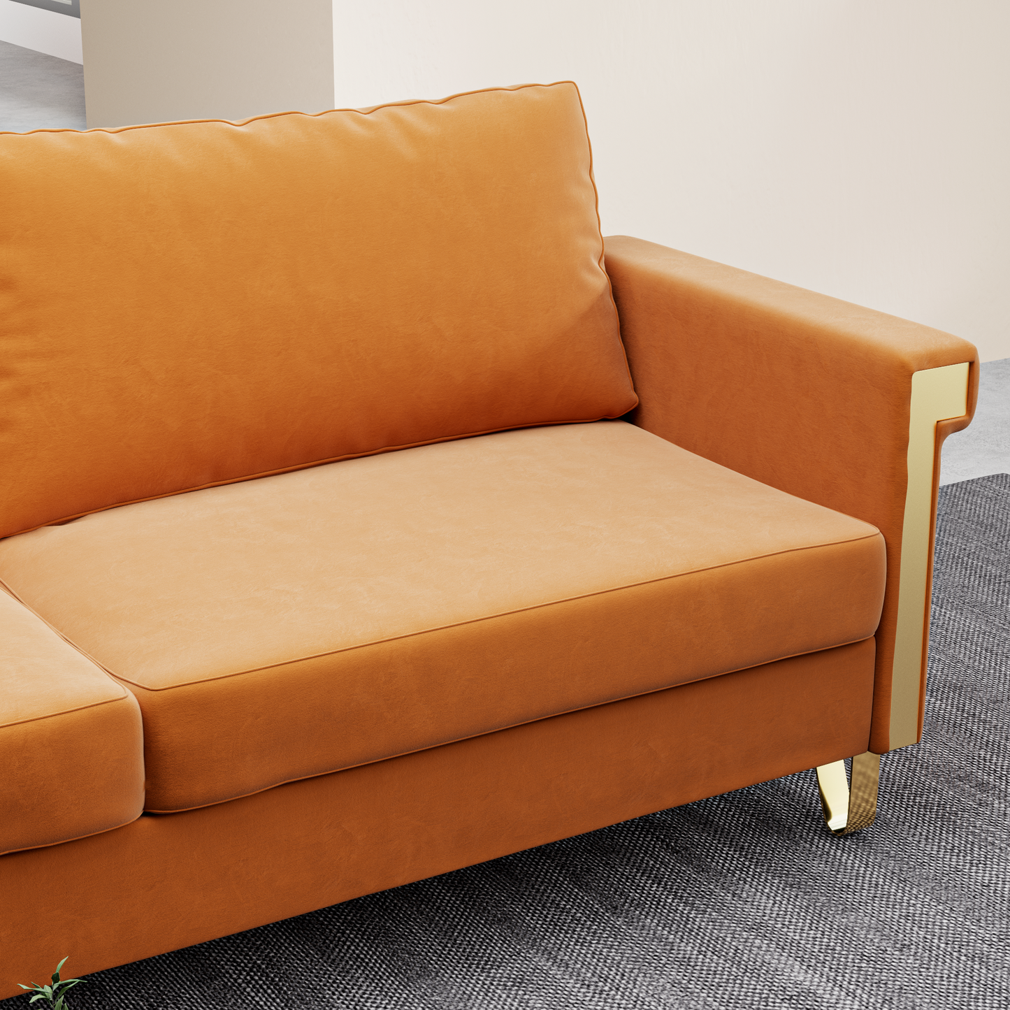 Plush orange velvet sofa with gold accents on the armrest perfect for a modern living room