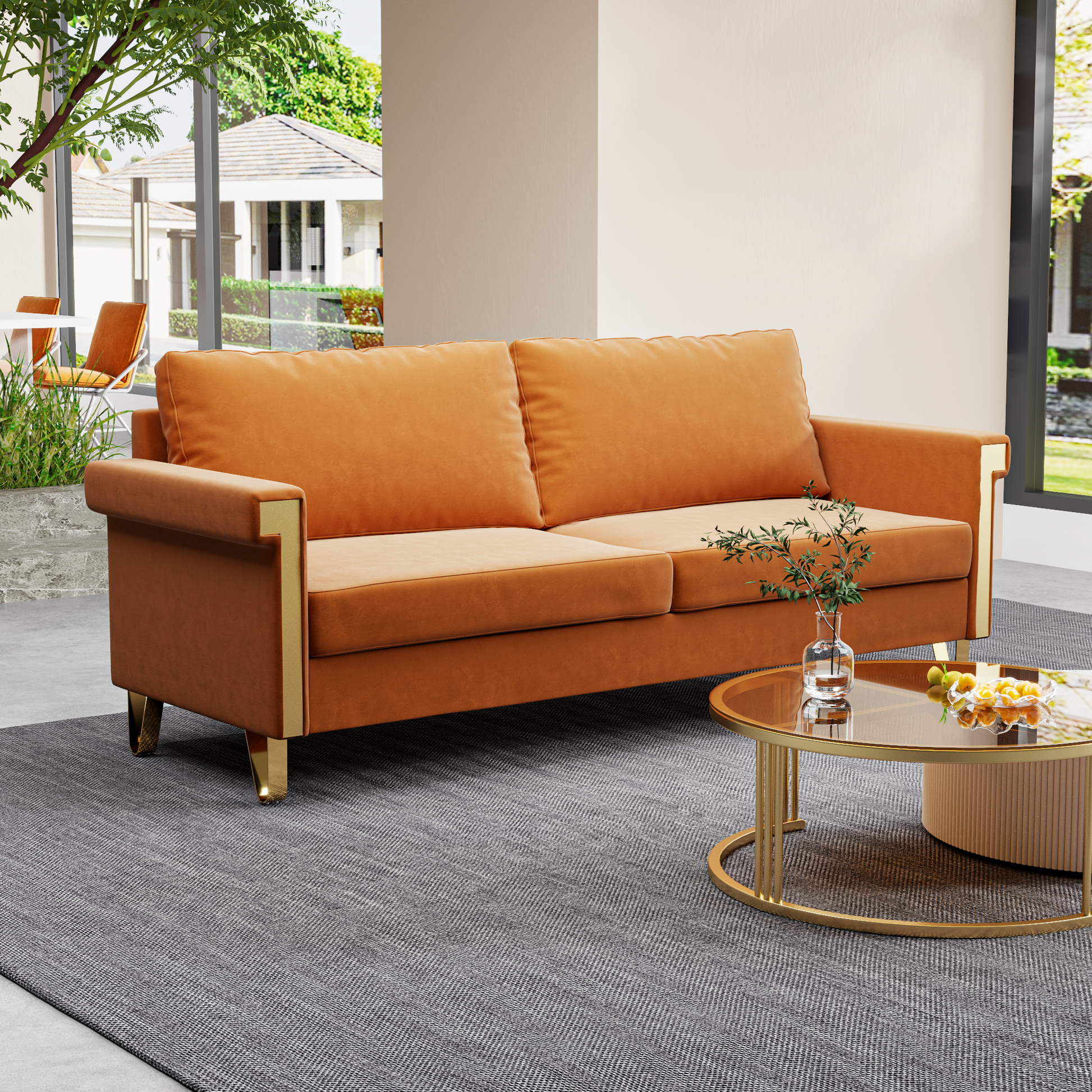 Orange velvet loveseat with gold accents perfect for modern living rooms