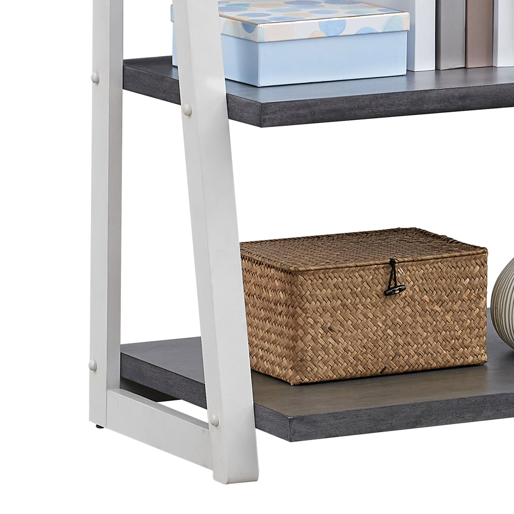 White and dark gray ladder bookshelf with woven basket on bottom shelf