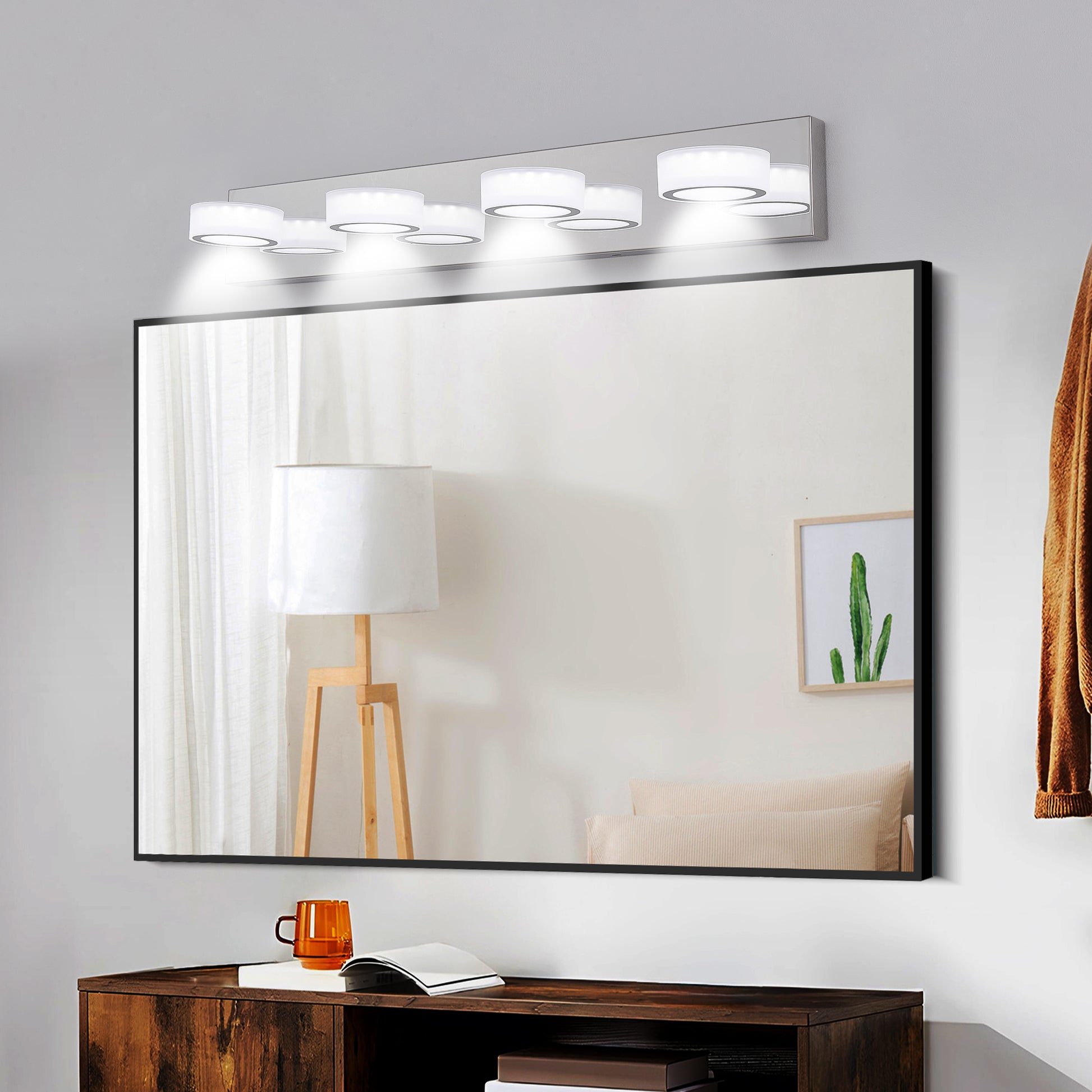 Modern vanity light fixture with six white cylindrical shades and brushed nickel accents