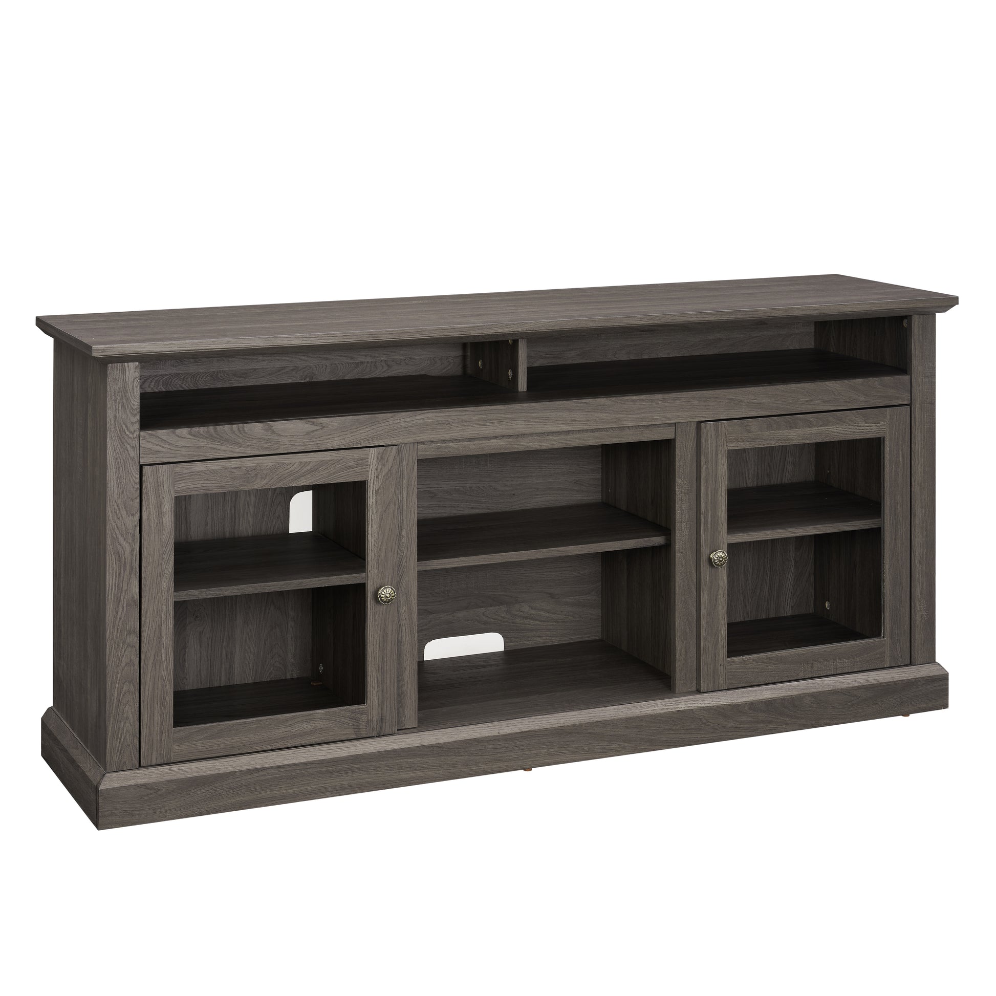 Grey wood media console with glass doors and open shelves for TV viewing