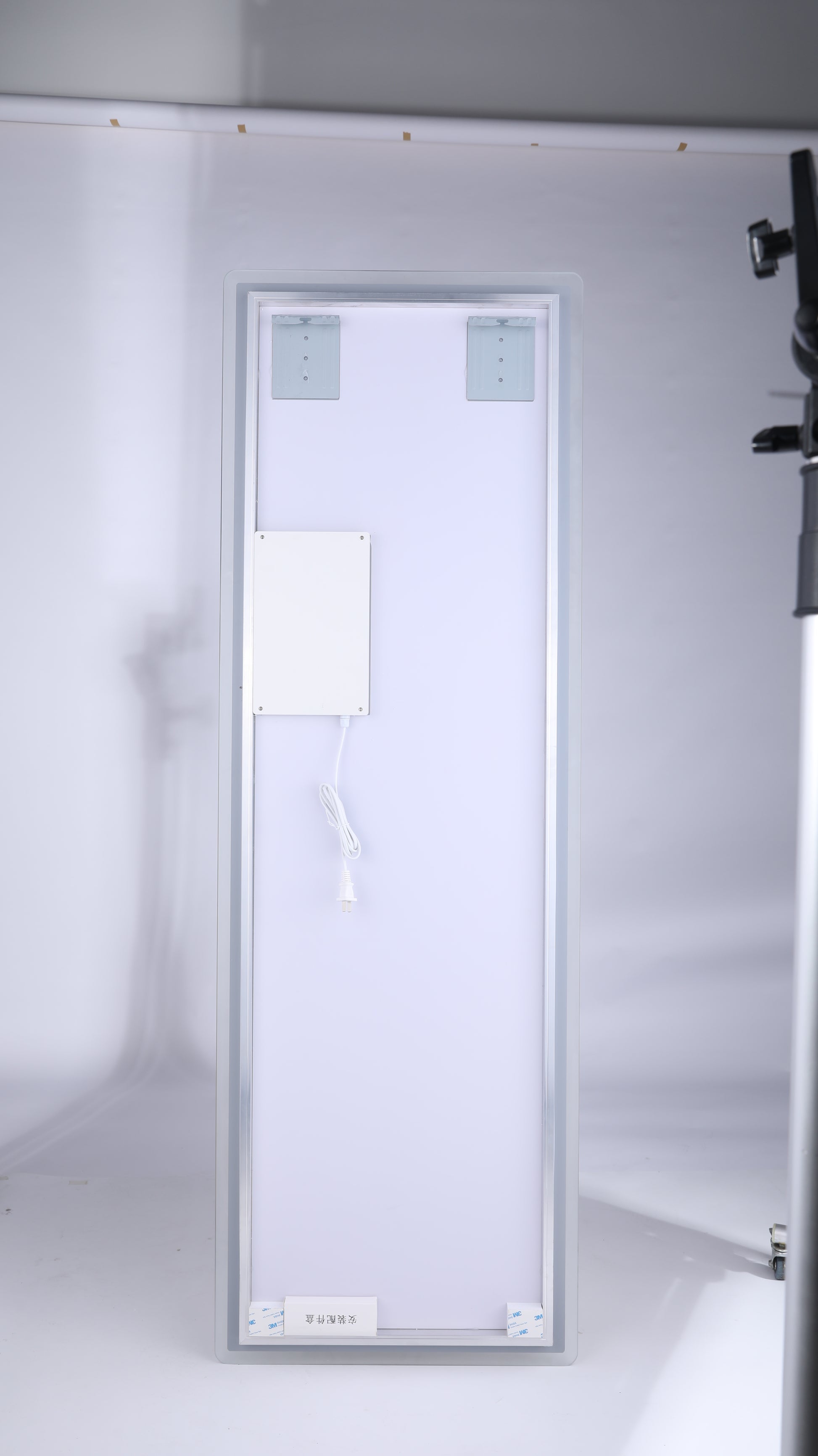 Slim LED light panel with mounting brackets and integrated power cord