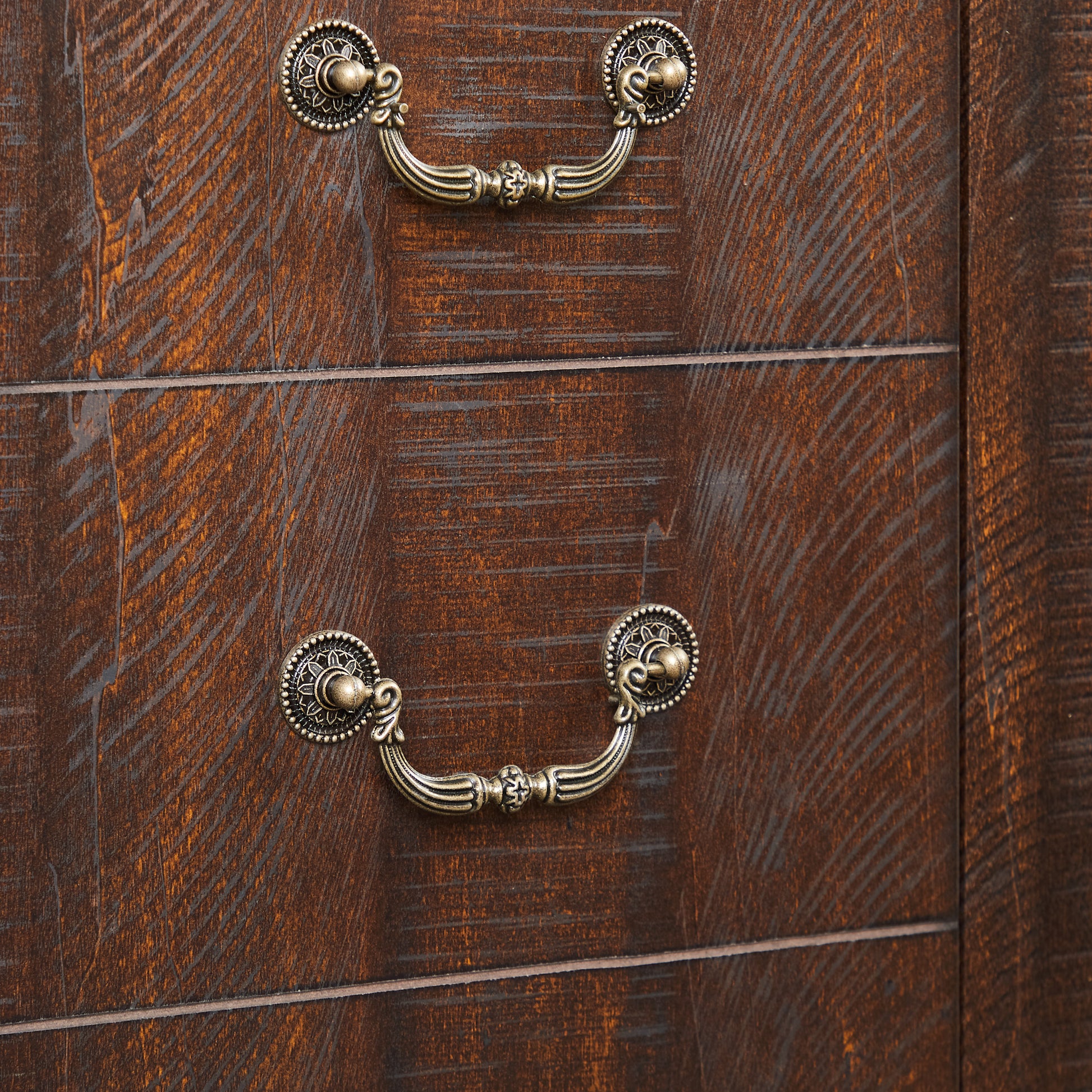 Dark wood dresser with antique brass ornate drawer pulls