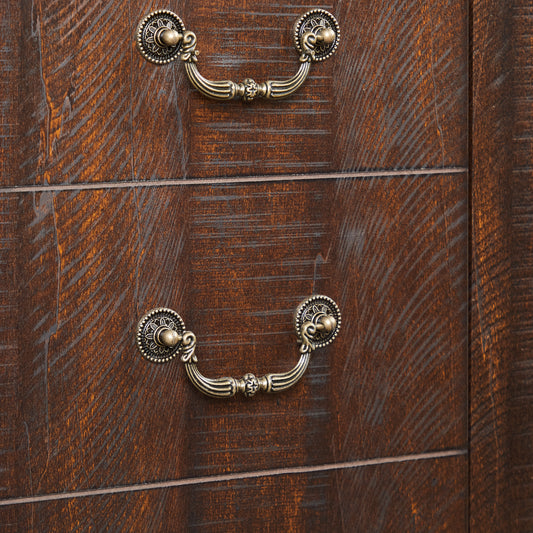 Dark wood dresser with antique brass ornate drawer pulls