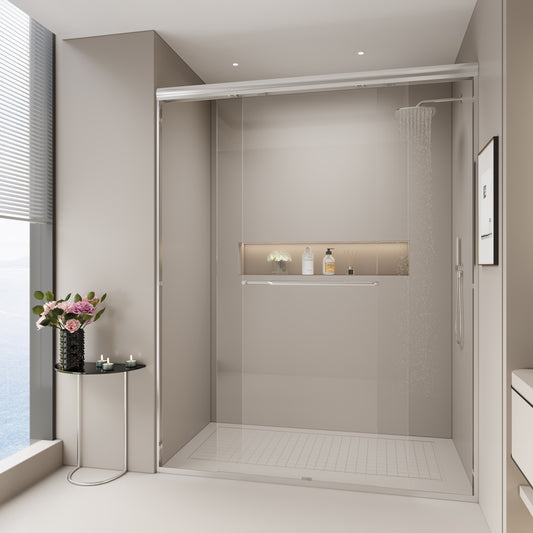 Modern frameless glass shower enclosure with brushed nickel hardware and rain showerhead