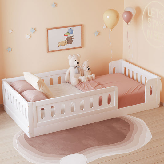 White toddler bed with railing pink bedding and teddy bears