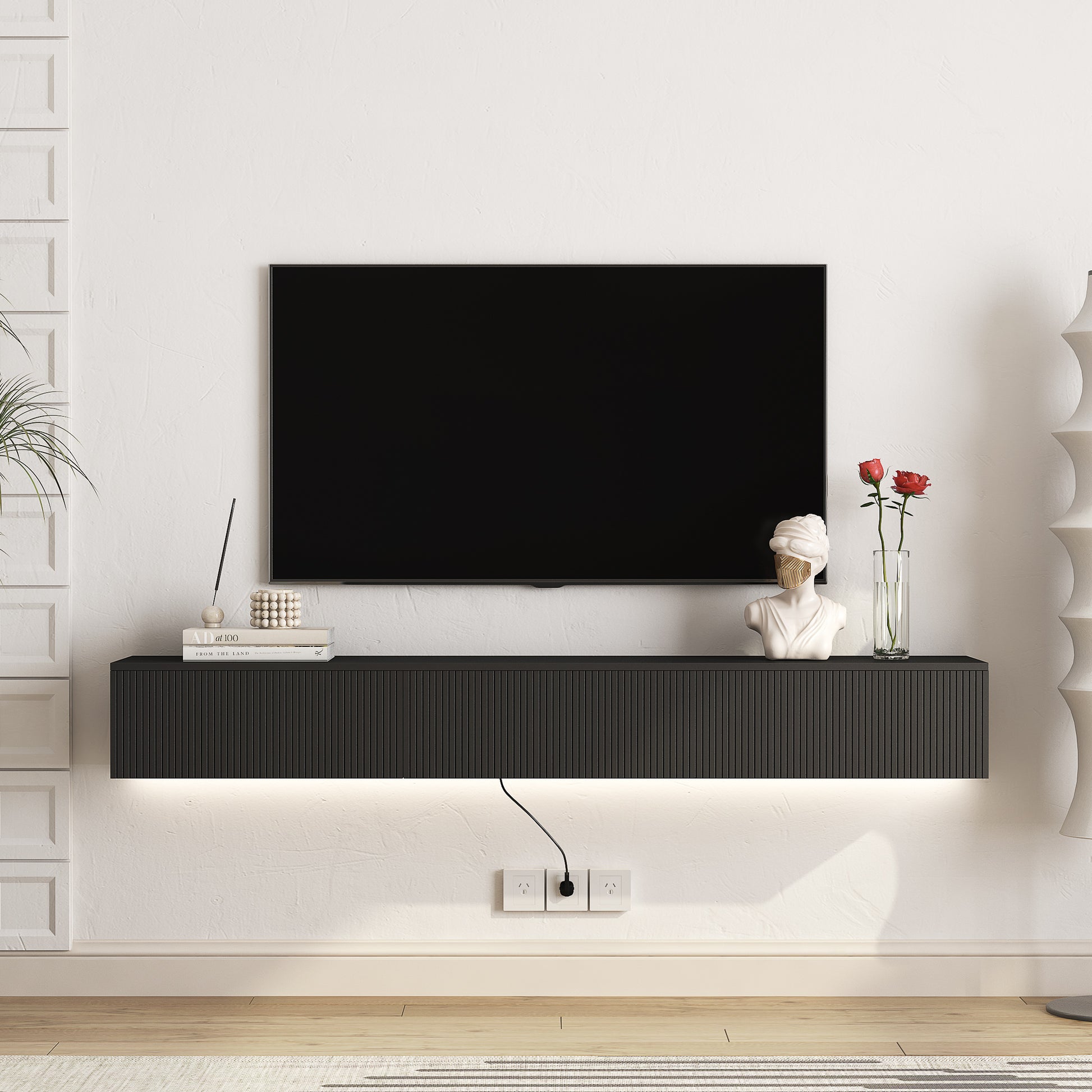 Modern black media console with ribbed front and LED lighting for TV setup