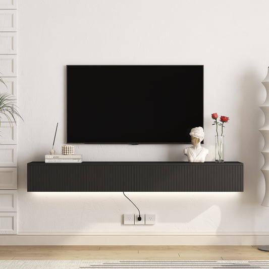 Modern black media console with ribbed front and LED lighting for TV setup