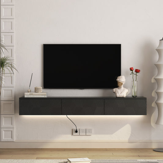 Floating black media console with geometric front panel undercabinet lighting