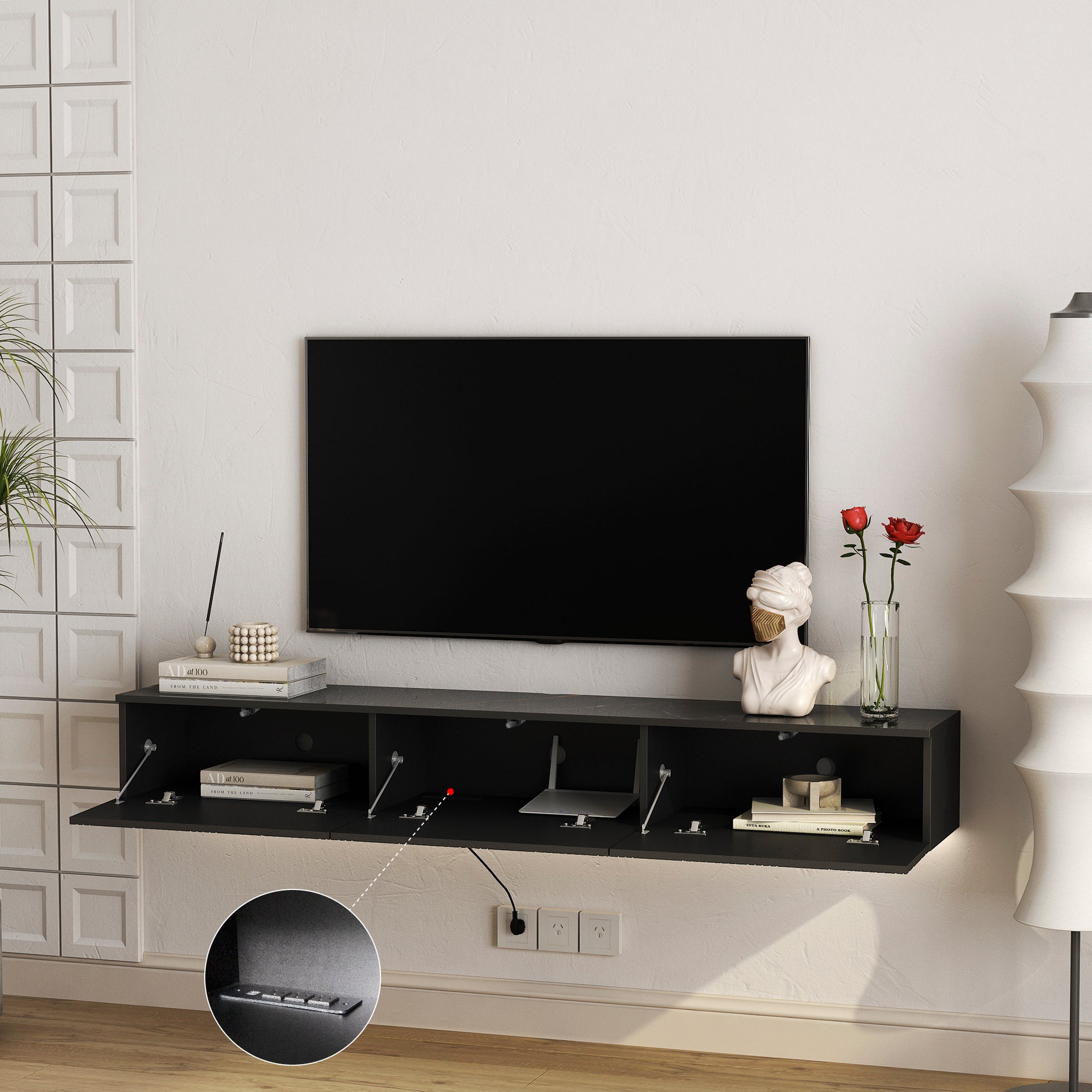 Sleek black wallmounted TV stand with dropdown doors and interior storage for electronics