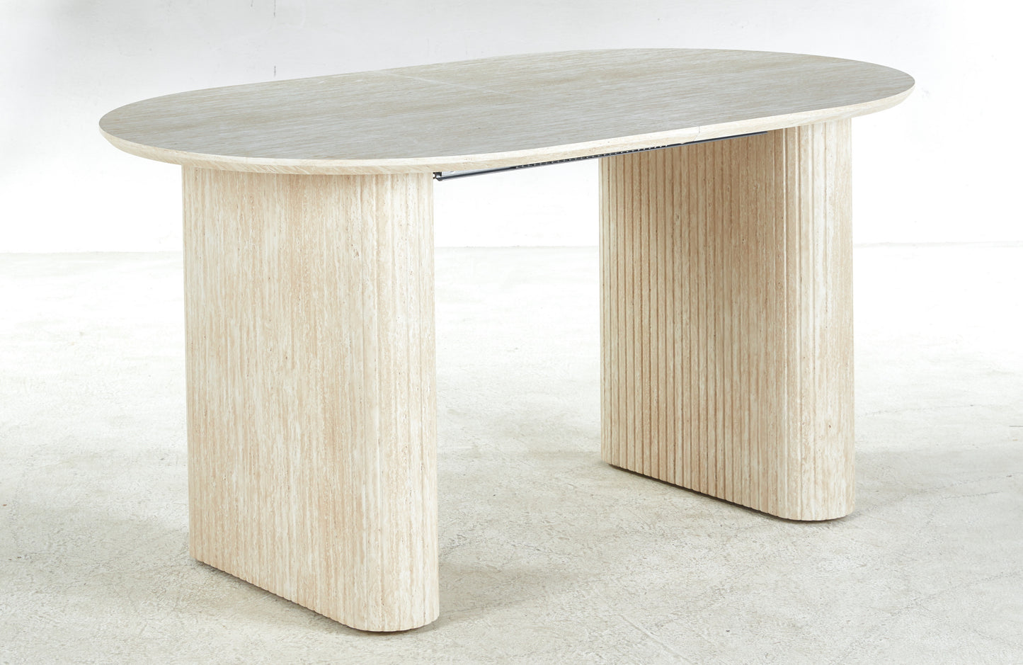 Light beige oval travertine desk with ribbed pedestal legs modern design