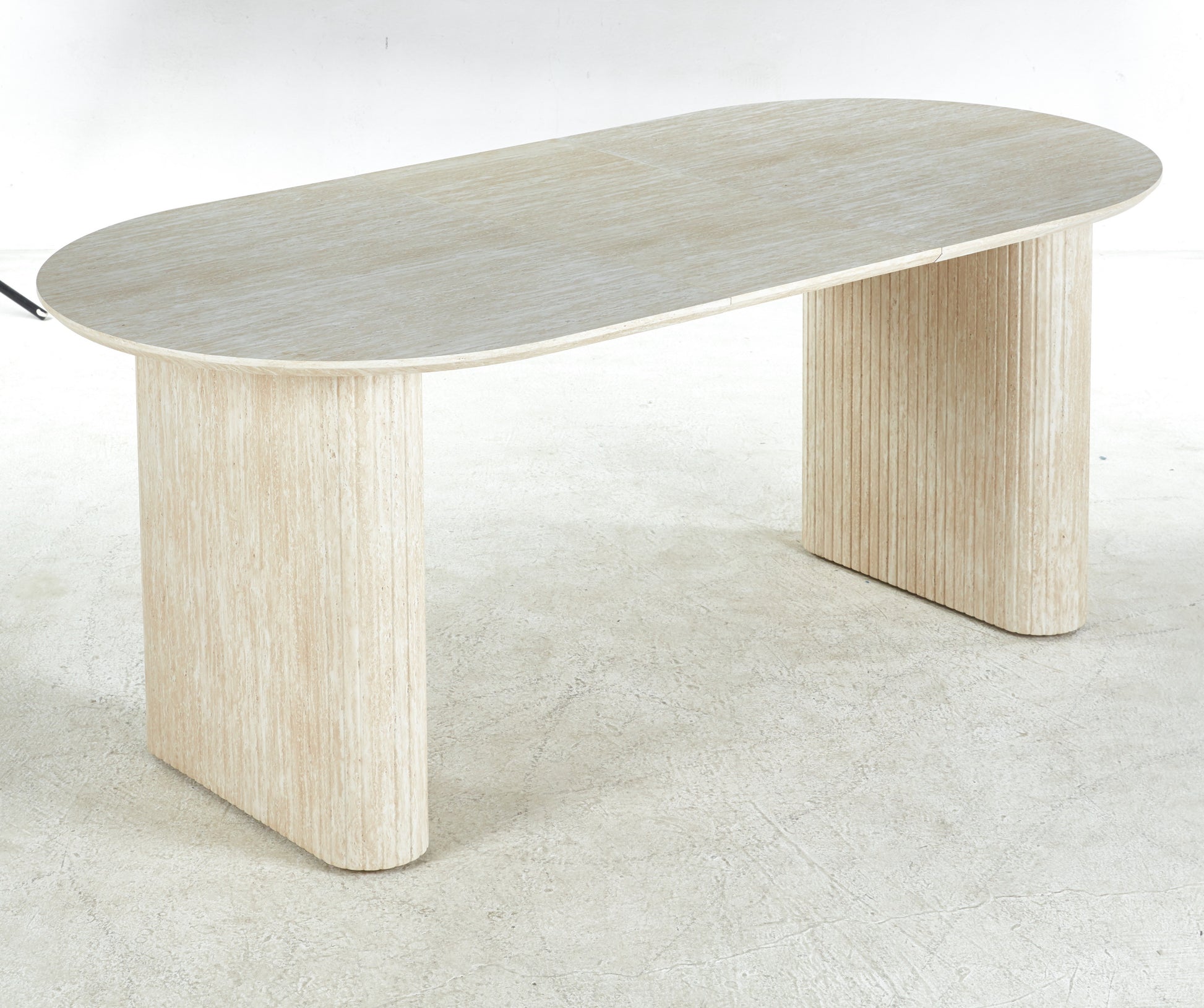 Pale wood oval desk with fluted column legs