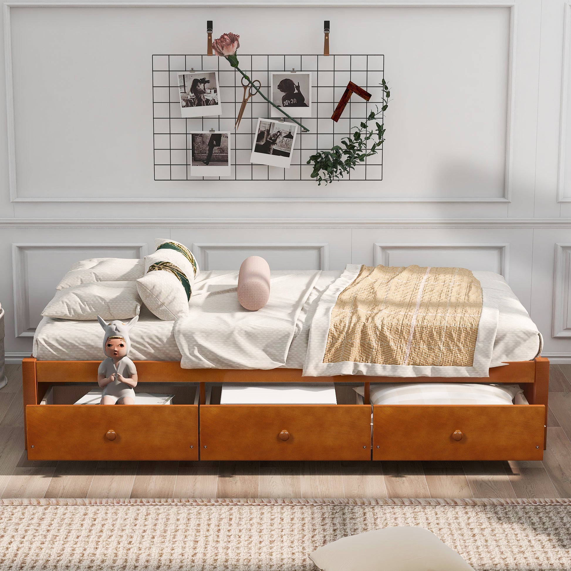 Wooden daybed with three storage drawers in a warm honey finish