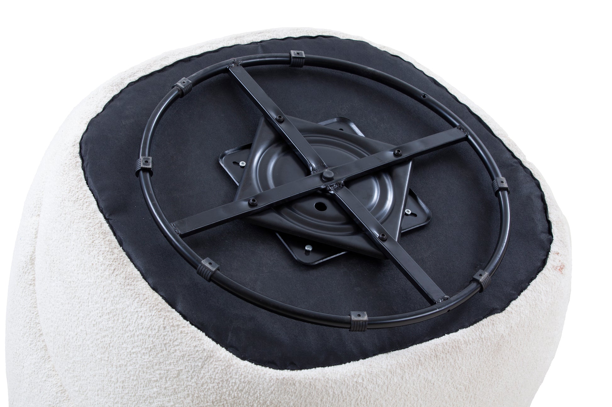 Closeup of a white boucle upholstered ottoman base with a black metal swivel mechanism