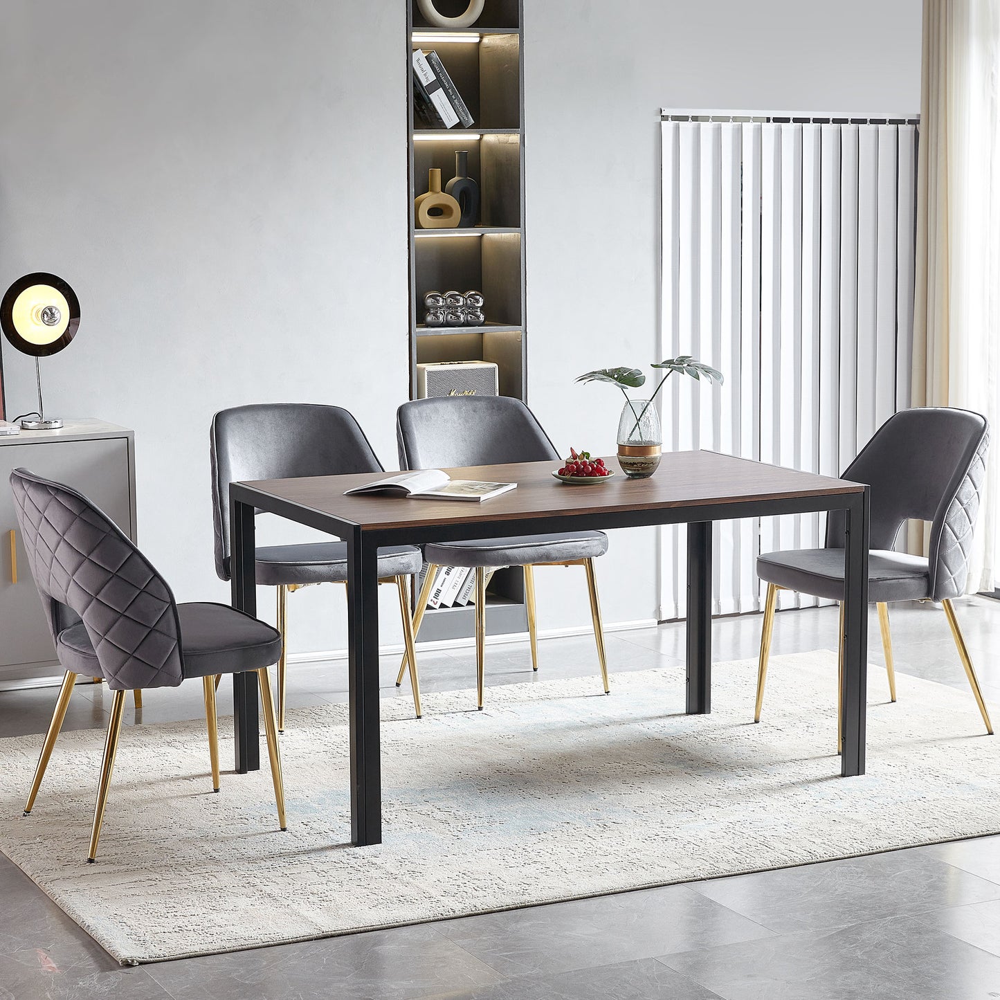 Luxurious grey velvet dining chair with quilted back and gold legs for a modern dining room