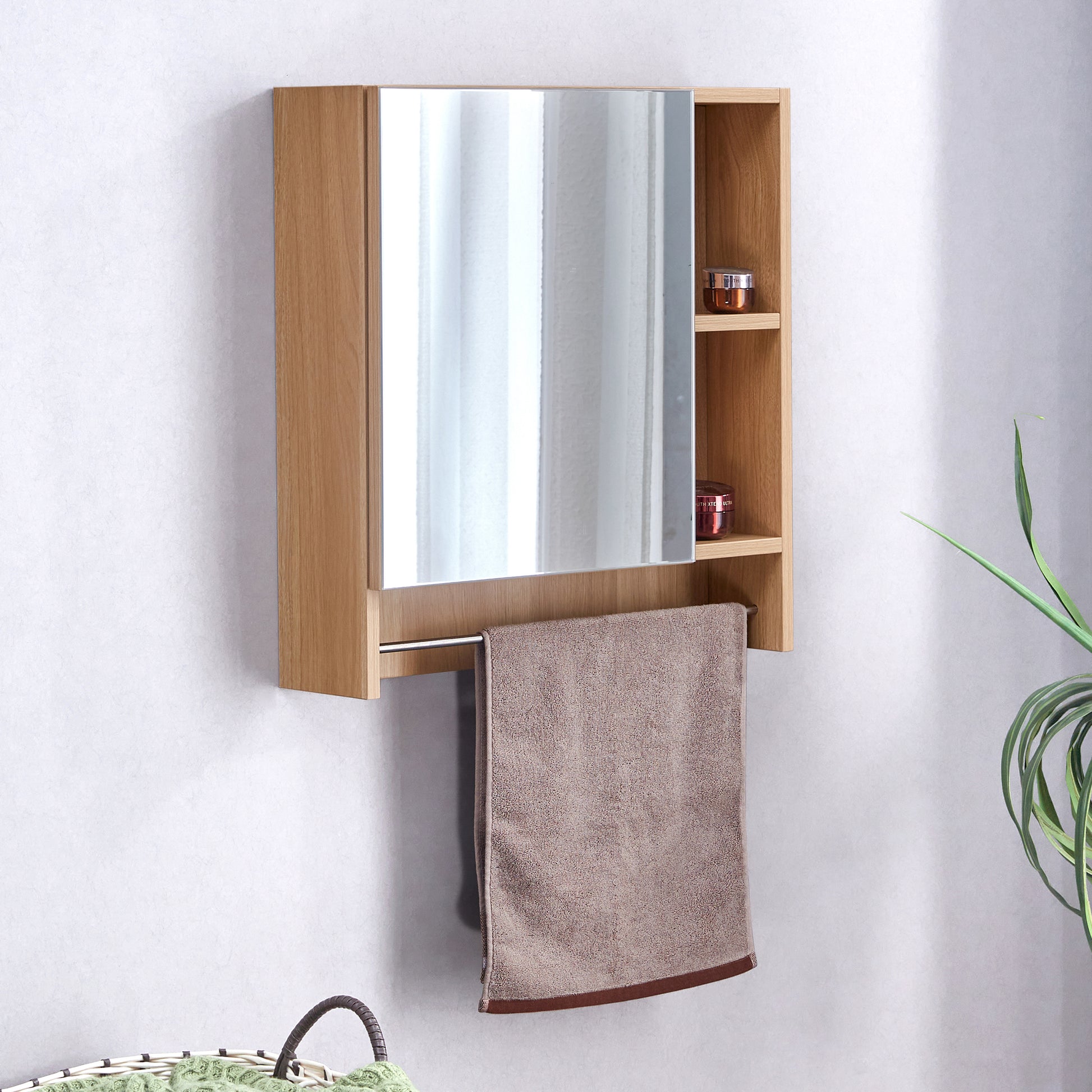 Light oak bathroom cabinet with integrated mirror and towel bar