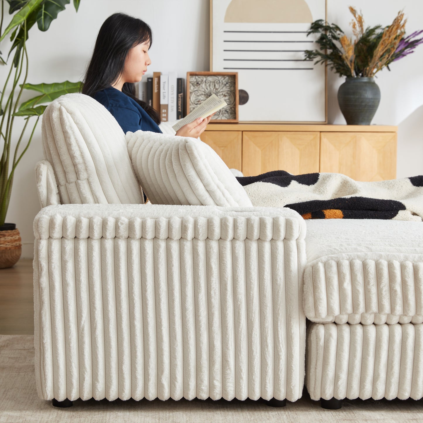 Plush cream corduroy sofa with soft throw pillows perfect for cozy living rooms