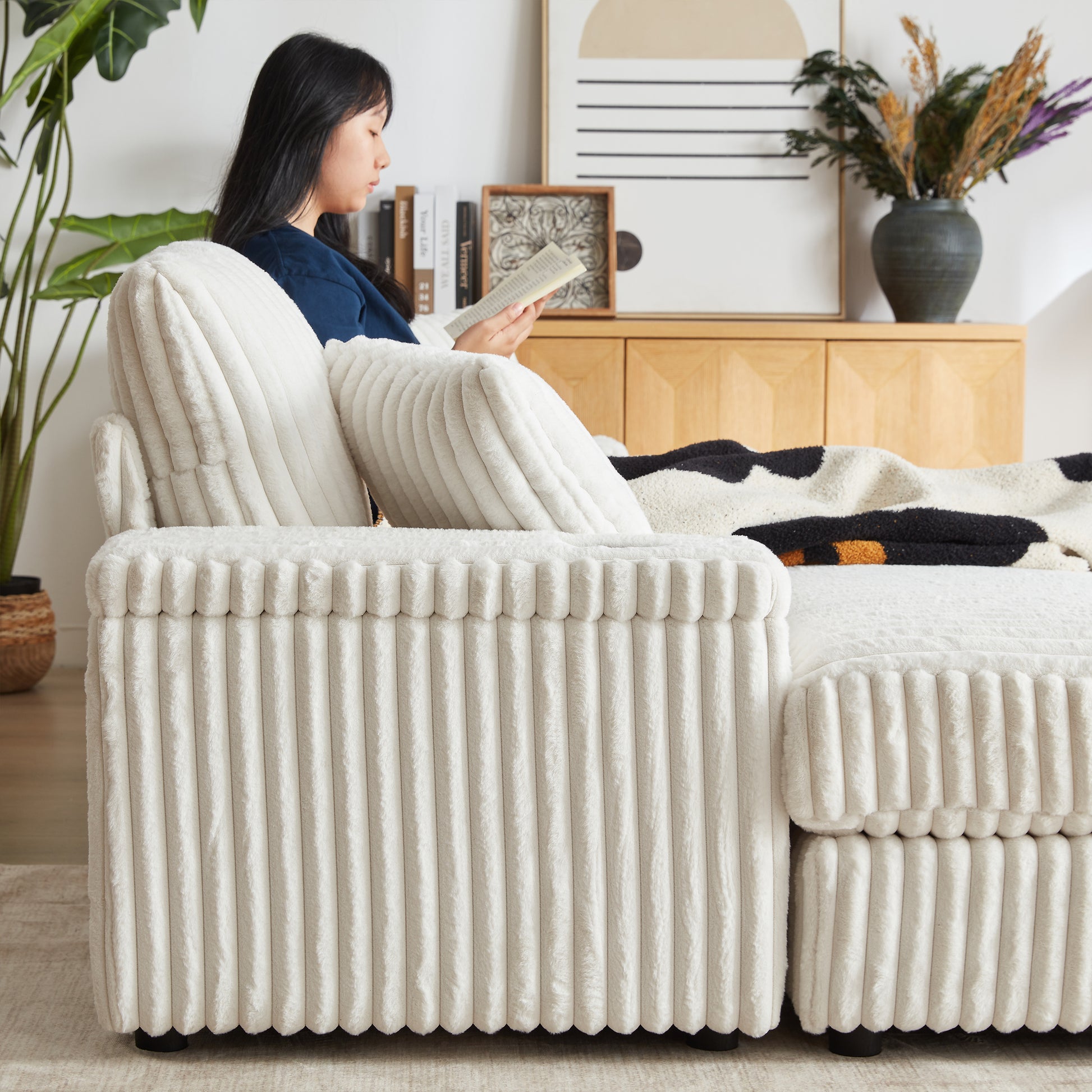 Plush cream corduroy sofa with soft throw pillows perfect for cozy living rooms