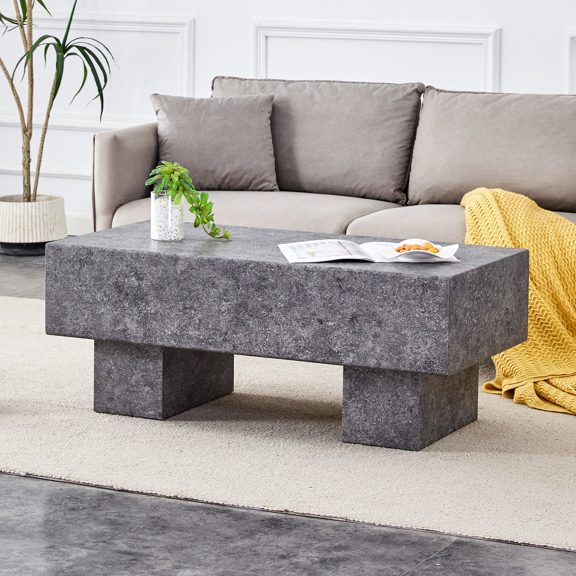 Dark gray rectangular concrete coffee table with a minimalist design